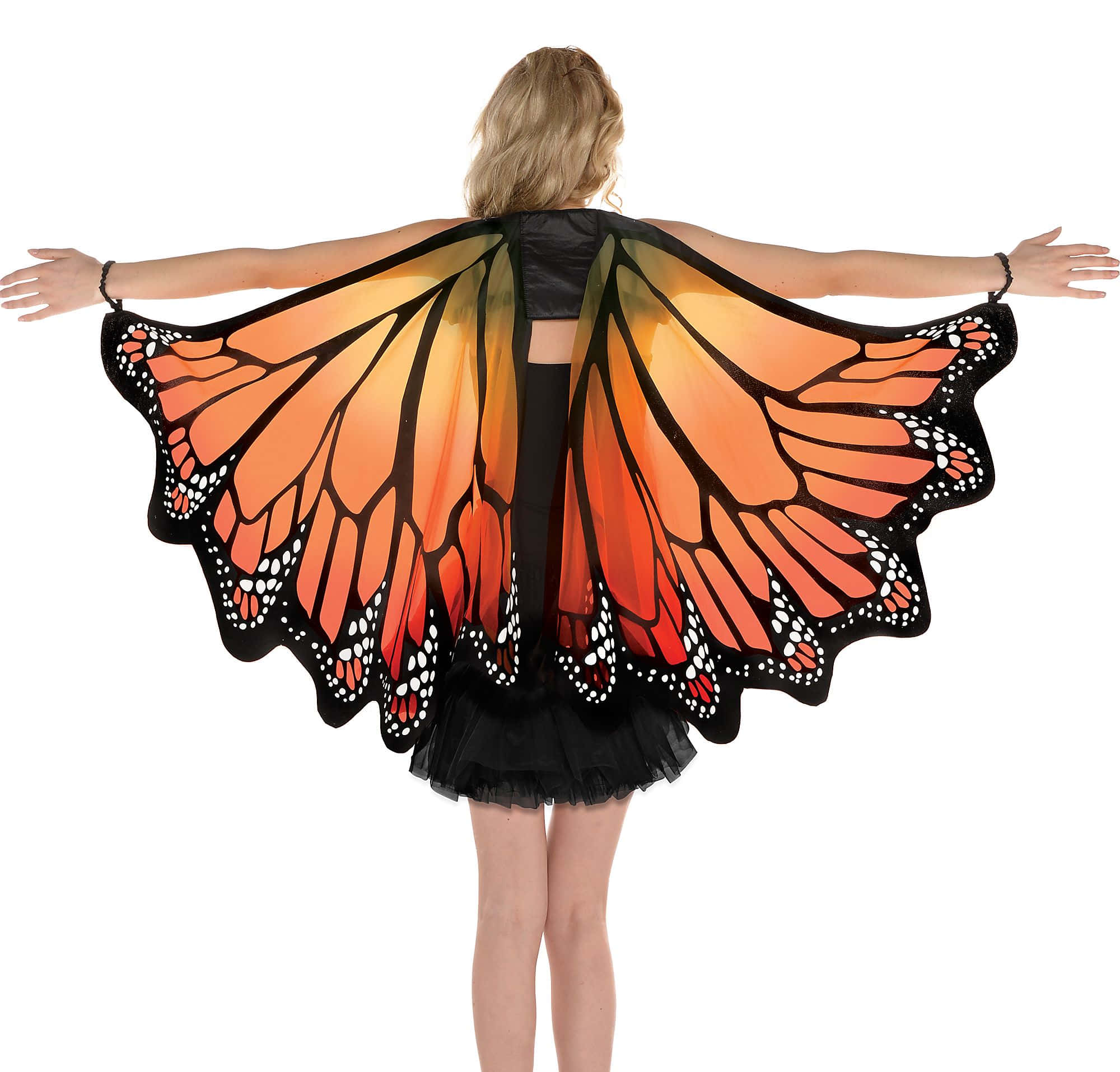 Butterfly Wing Dress 桌布 壁紙 — 從背後看到一個人穿著一件大型帝王蝶翅膀服裝，上面有橙色、黑色和白色的圖案，背景是純白色。