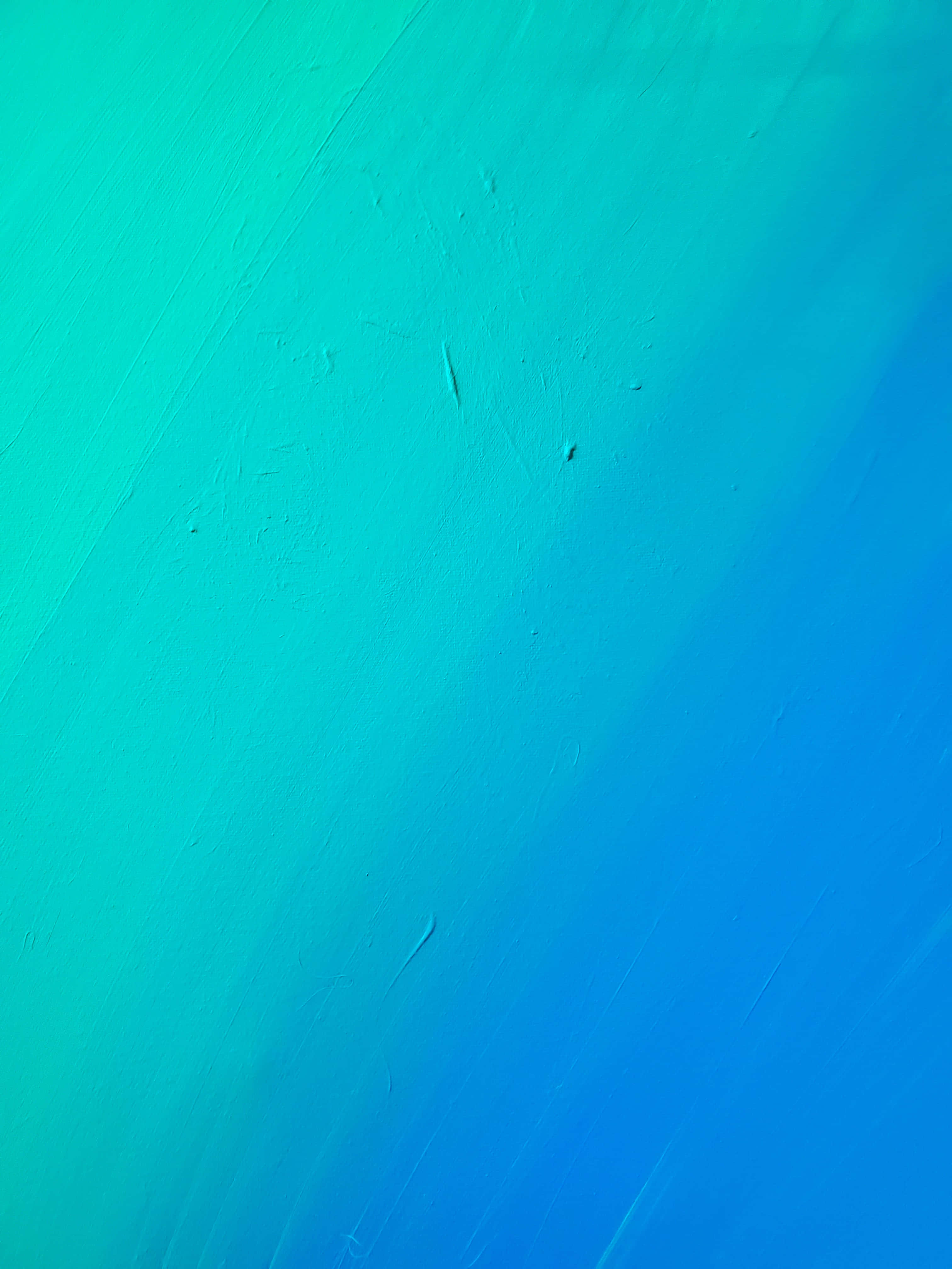 Turquoise iPhone 桌布 壁紙 — 從青綠色到藍色的平滑漸變，表面帶有可見的筆觸和細微紋理。