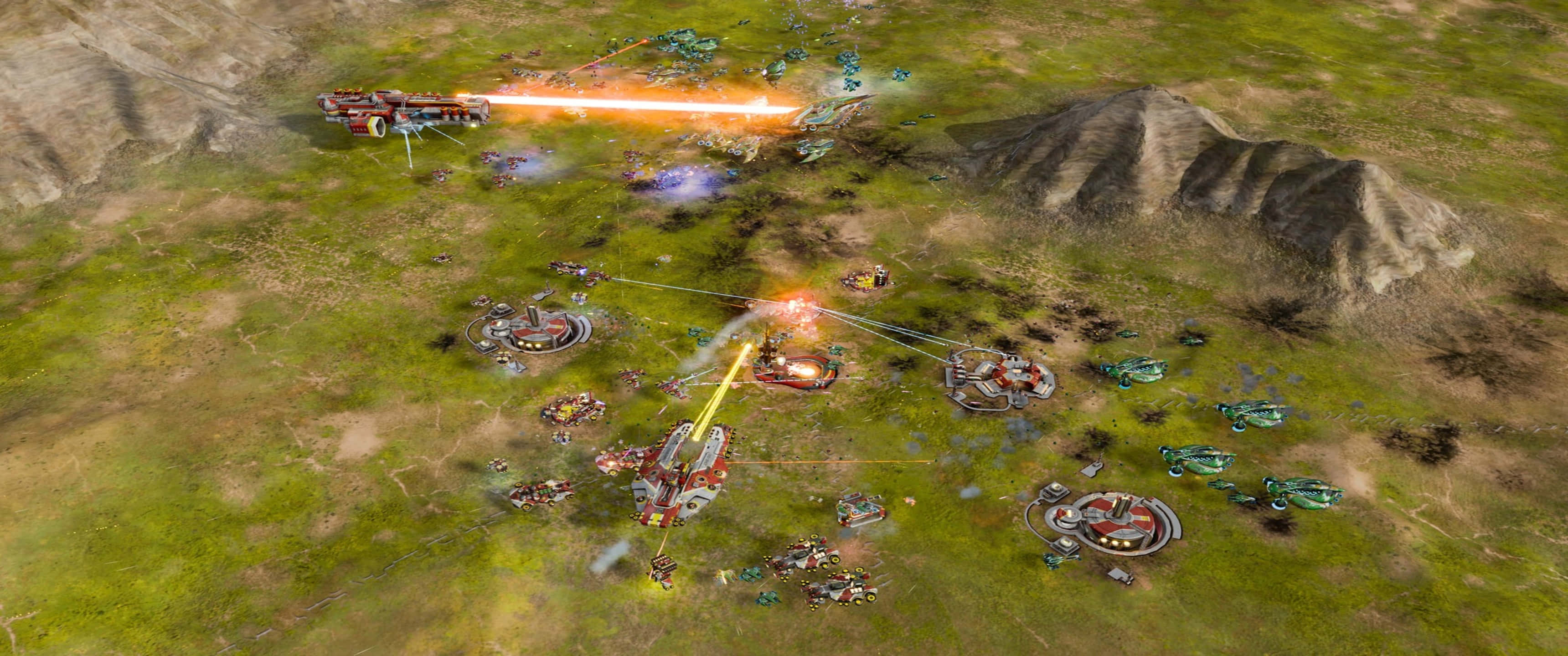 3440x1440p Ashes Of The Singularity Escalation 桌布 壁紙 — 從高空俯瞰，未來戰艦和基地在草地戰場上發射雷射，背景是山脈。