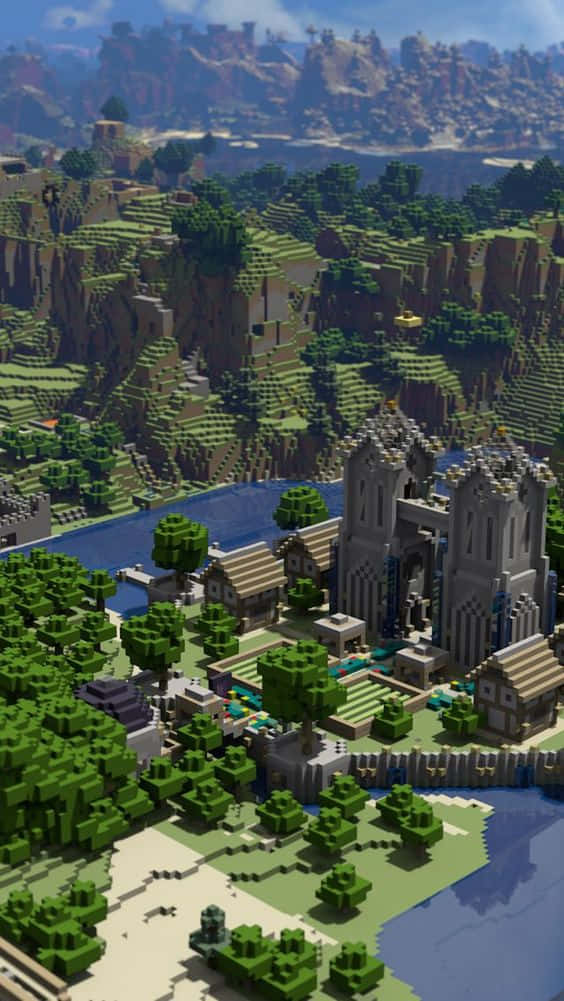 桌布 壁紙 — 從高空俯瞰Minecraft村莊，石城堡與河流坐落於塊狀綠色丘陵中，天空明亮。