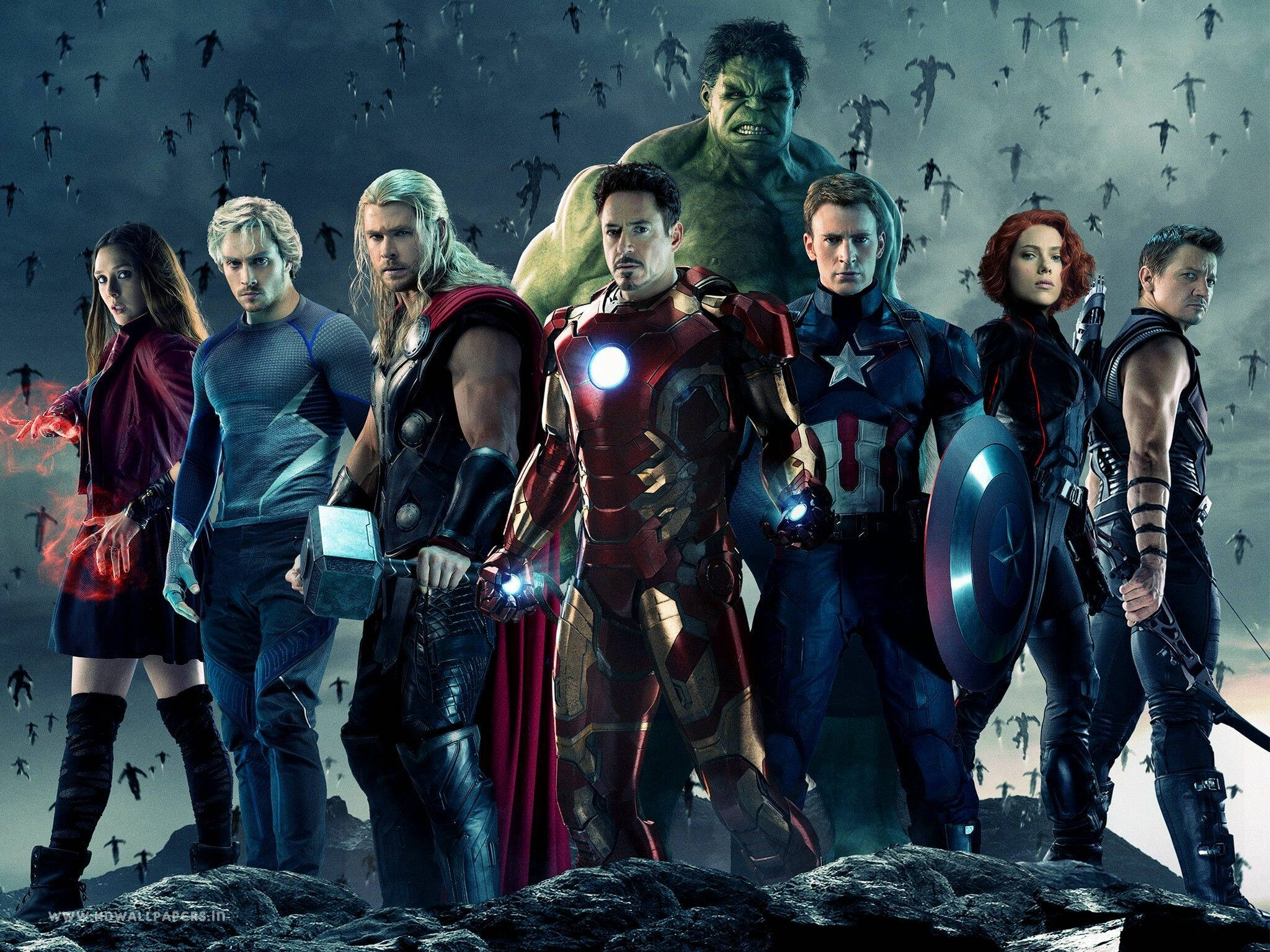 4K Marvel 壁紙 桌布 壁紙 — 復仇者聯盟聚集在岩石懸崖上，敵人的黑暗剪影在暴風雨的天空下蜂擁而至。