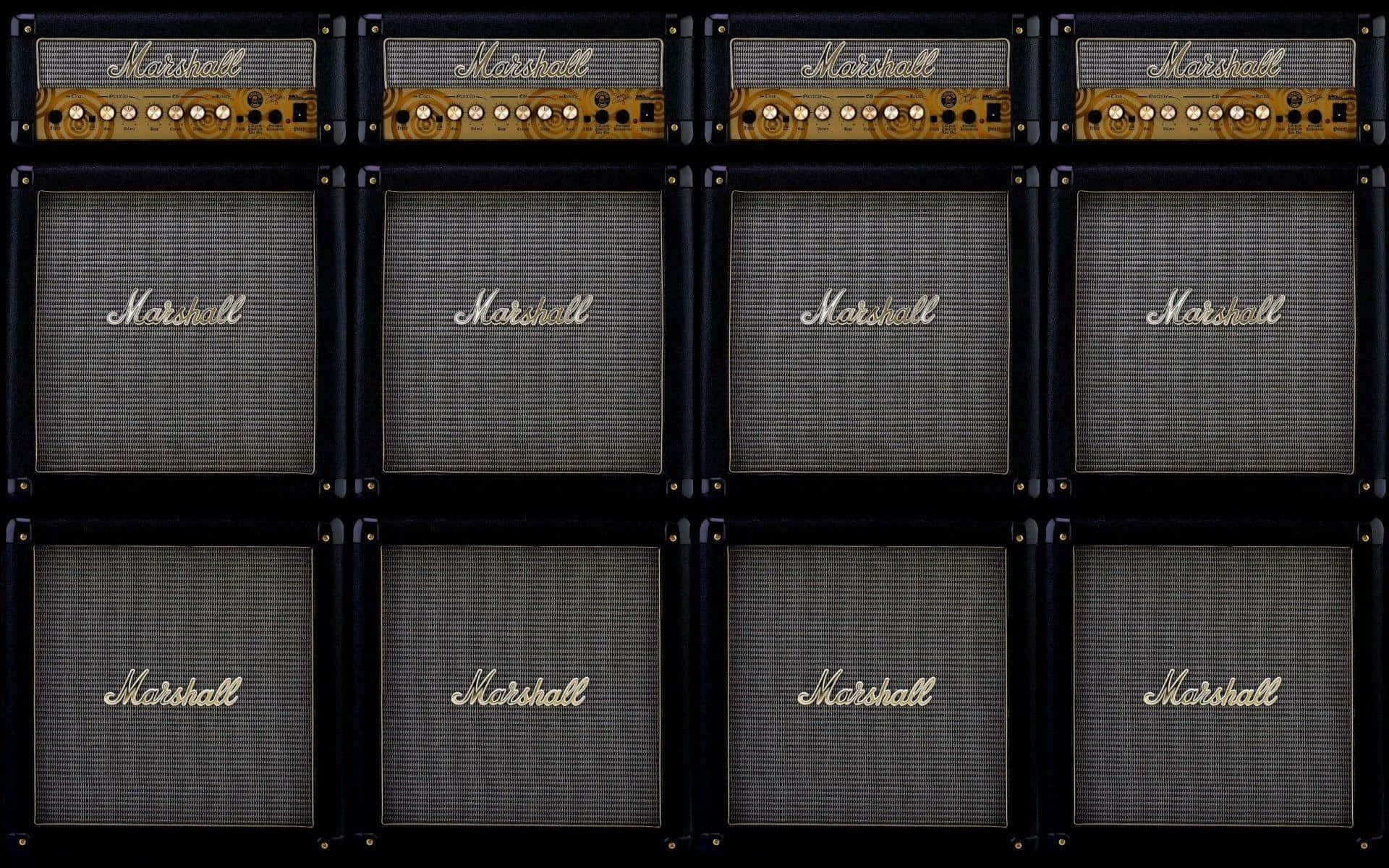 Marshall 桌布 壁紙 — 復古 Marshall 吉他擴大機網格，黑色機箱配金色標誌，對稱排列。