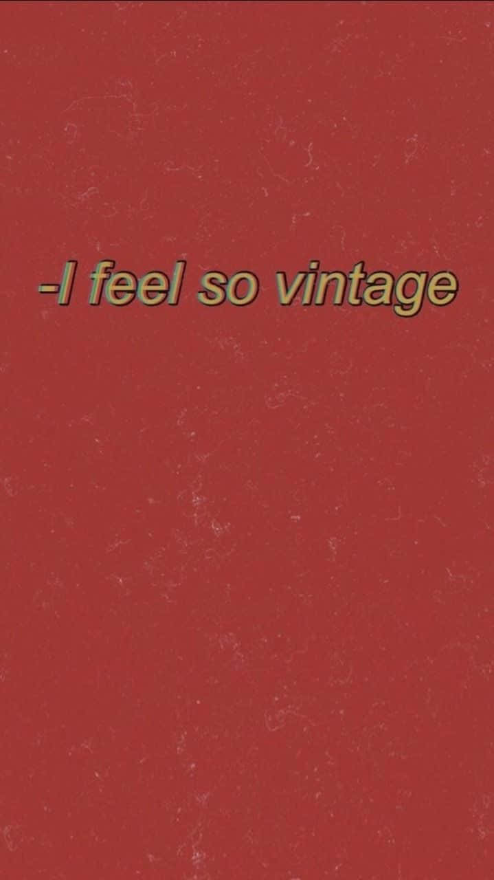 紅色動圖 桌布 壁紙 — 復古文字顯示「i feel so vintage」，背景為帶有細微白色斑點的紋理深紅色。