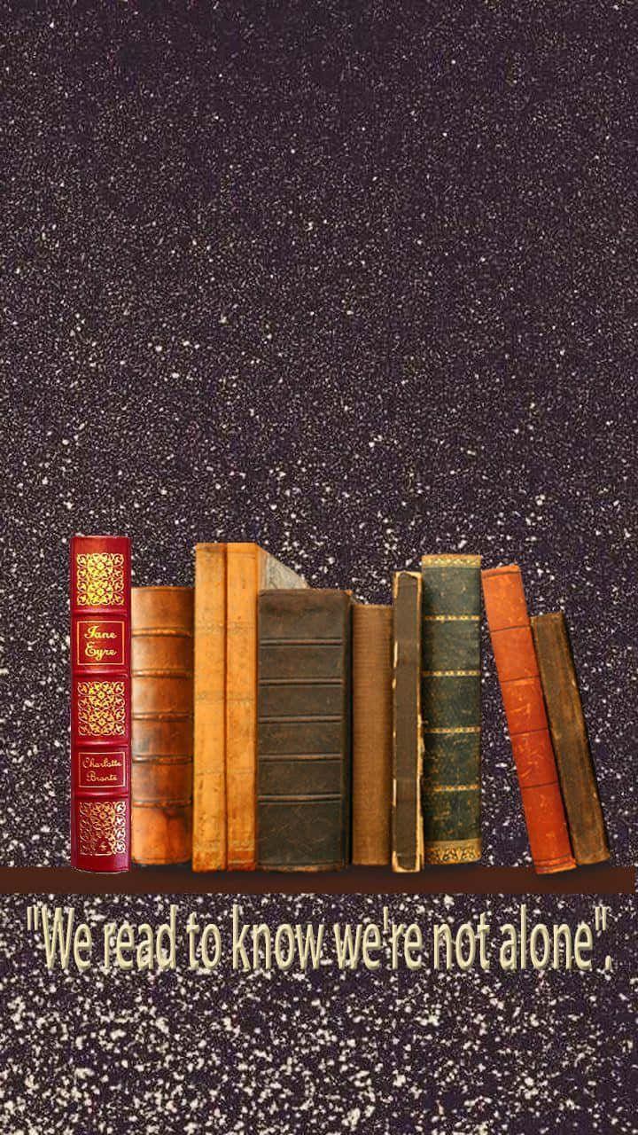 books 桌布 壁紙 — 復古書籍直立於繁星點點的夜空背景前，下方附有勵志語錄。