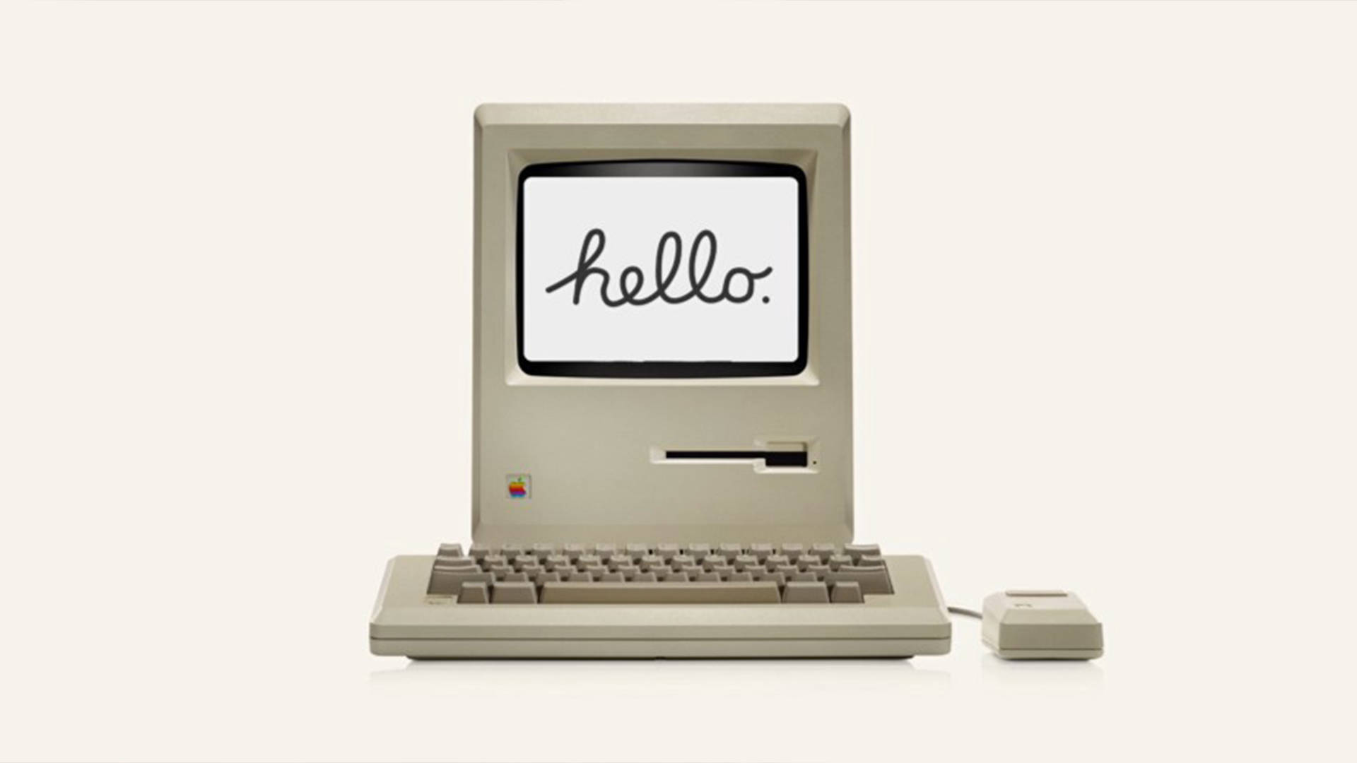 Retro 桌布 壁紙 — 復古米色 Macintosh 電腦，螢幕上顯示 'hello.'，背景簡潔。