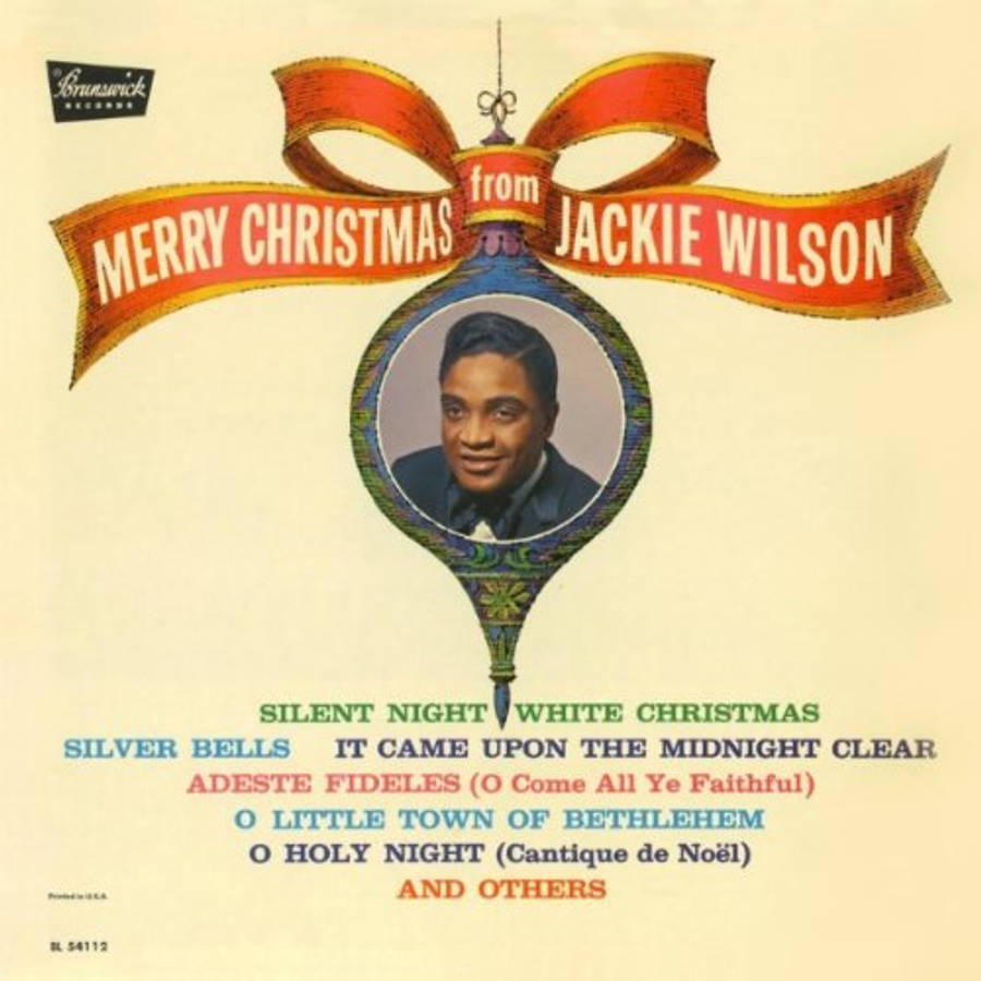 Singer 桌布 壁紙 — 復古聖誕專輯封面，Jackie Wilson 的肖像在裝飾華麗的飾物內，配有紅色絲帶和節日歌曲名稱。