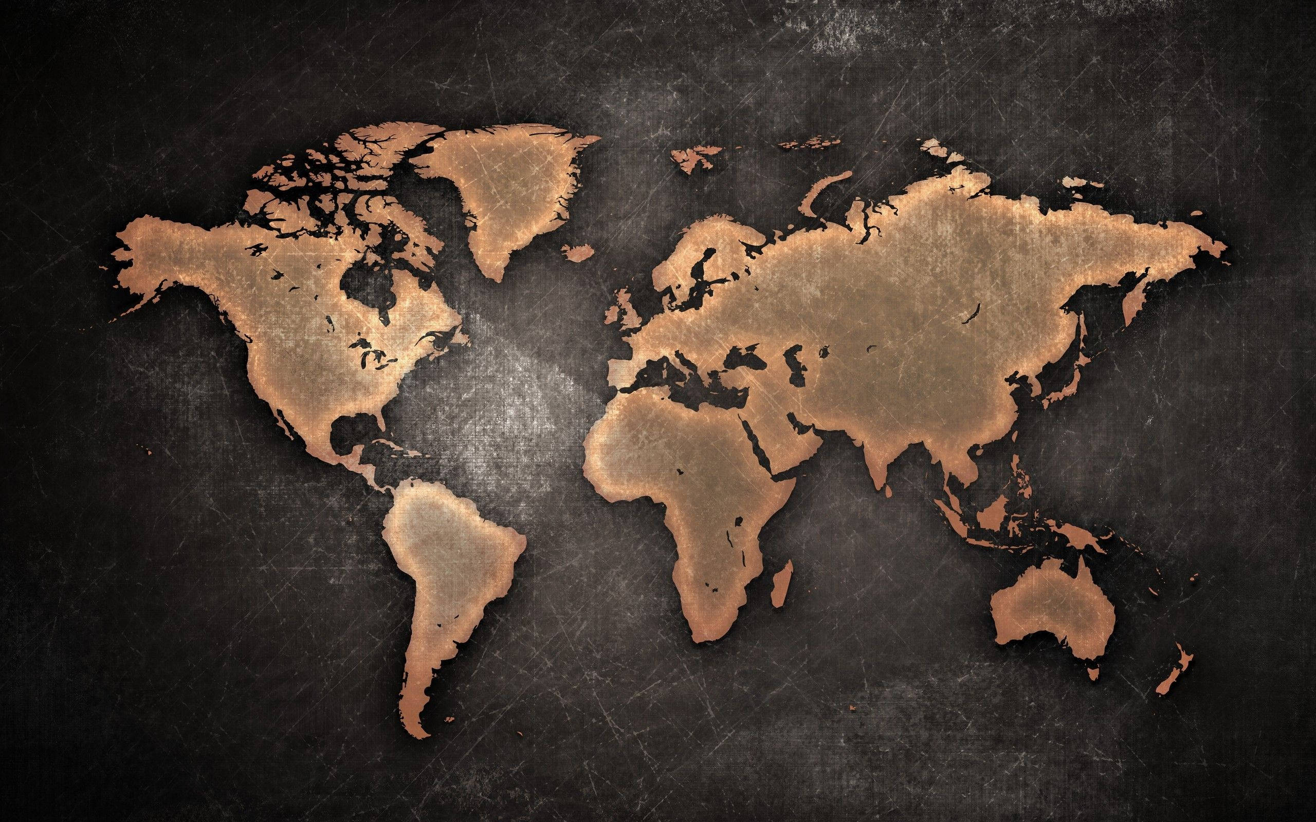 World 桌布 壁紙 — 復古銅色世界地圖剪影從帶有細微刮痕和磨損的紋理深灰色背景中浮現。