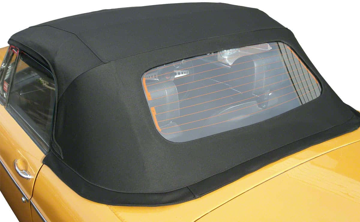 Car Hood 桌布 壁紙 — 復古黃色敞篷車黑色軟頂的特寫，後窗露出橙色內飾細節。