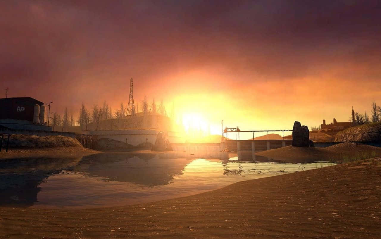 Half Life 2 桌布 壁紙 — 戲劇性的日落將熾熱的橙色和紫色色調投射在荒涼的工業景觀上，前景有一個反射的水坑。