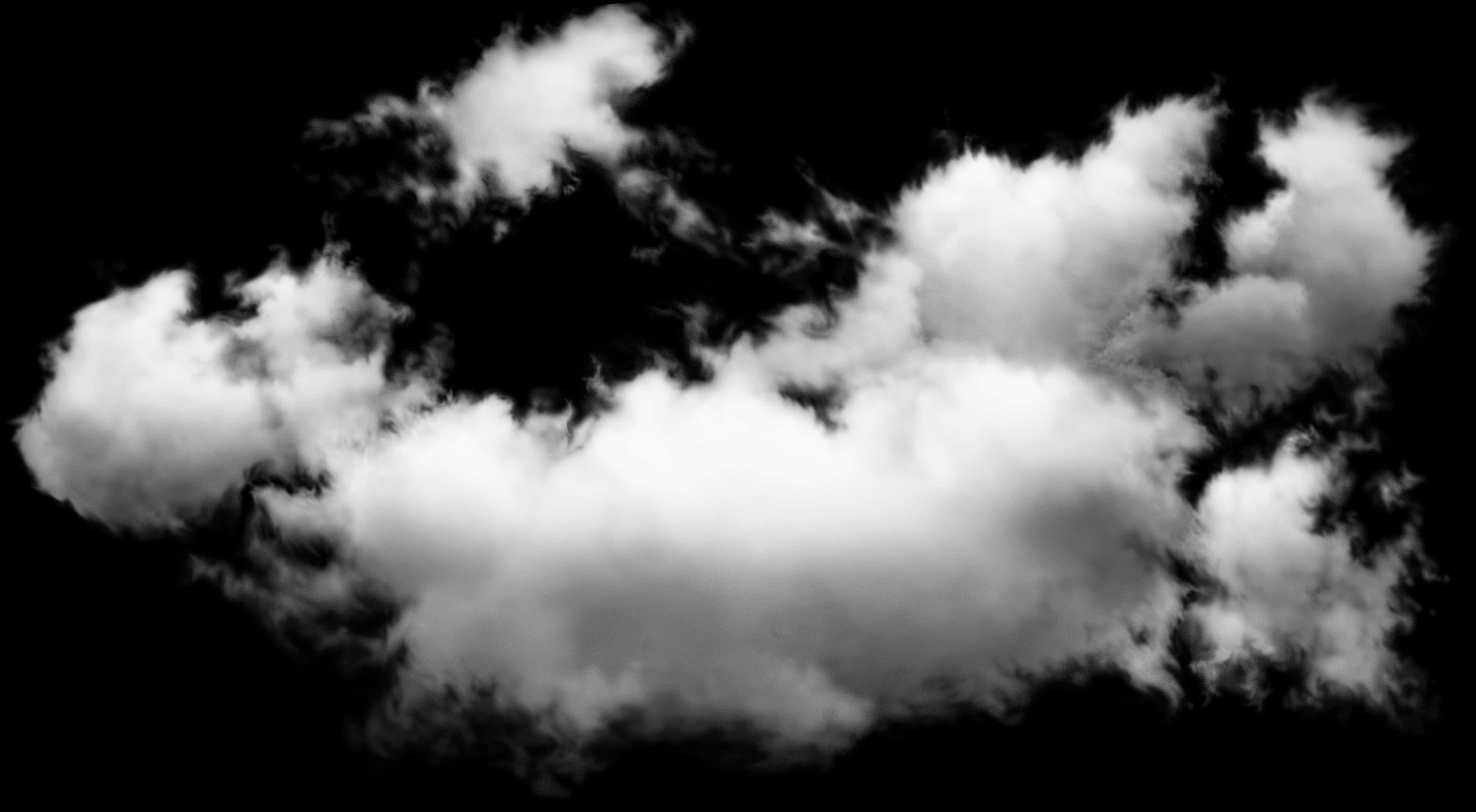 雲朵 桌布 壁紙 — 戲劇性的白色雲朵在純黑色背景上以高對比單色旋轉。