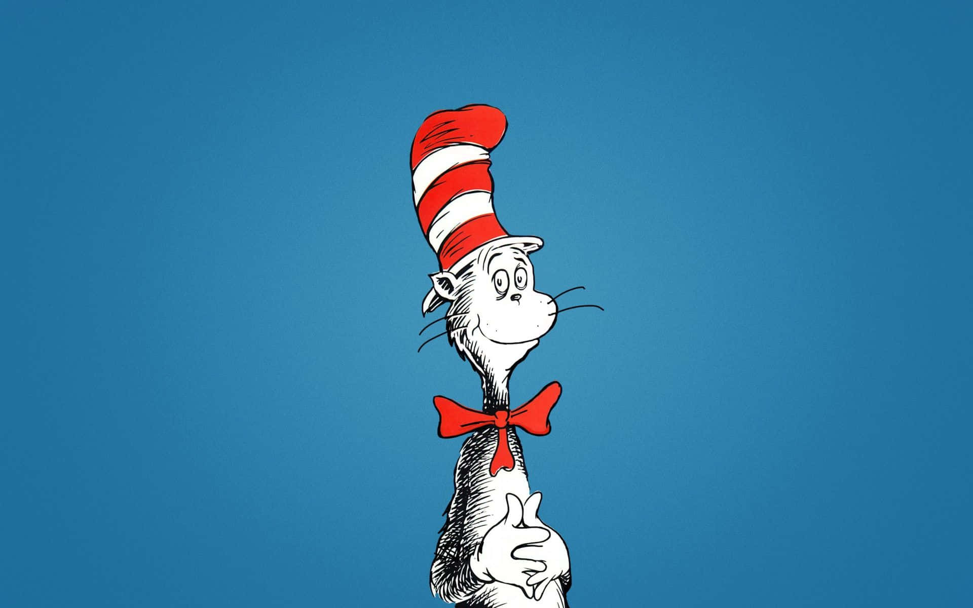 Dr Seuss 桌布 壁紙 — 戴帽子的貓站在純藍色背景前，戴著其標誌性的紅白條紋帽子和紅色領結。