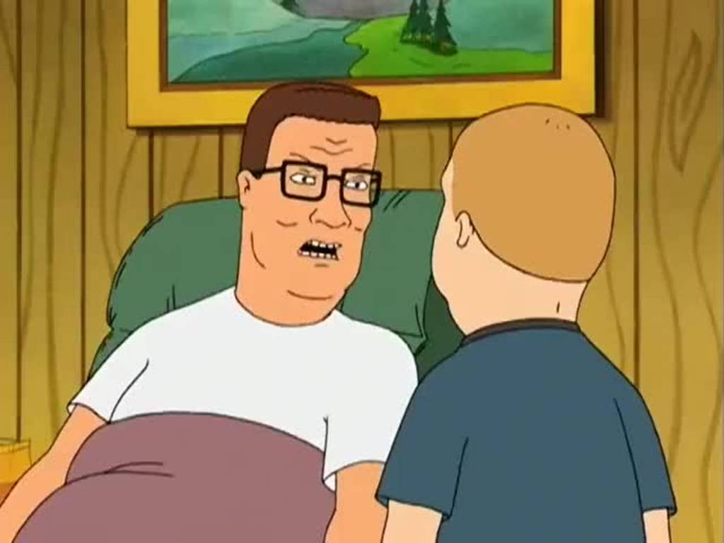 Bobby Hill 桌布 壁紙 — 戴眼鏡的卡通爸爸在木牆房間裡憤怒地與兒子對峙。