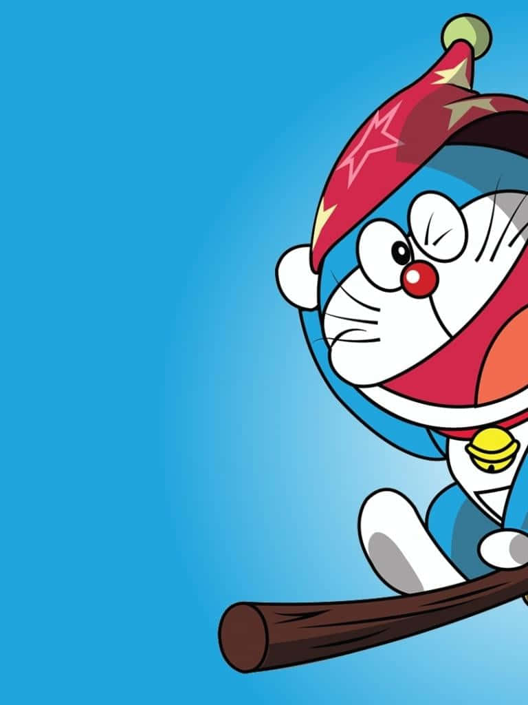 Doraemon 桌布 壁紙 — 戴著紅色星星帽的哆啦A夢從右邊探出頭來，手持木棒，背景為純藍色。