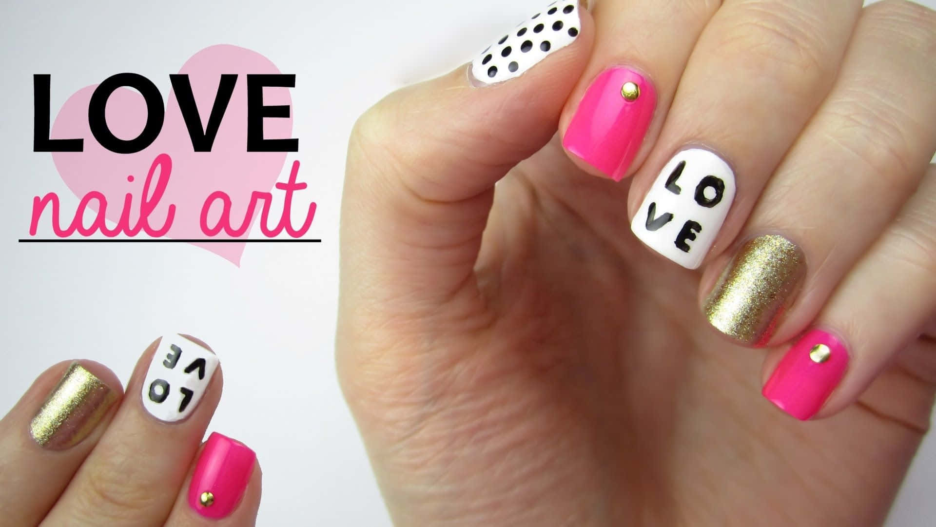 Nail 桌布 壁紙 — 手展示充滿活力的粉紅金色和白色指甲，帶有 'LOVE' 字樣和圓點圖案，背景為純白色。