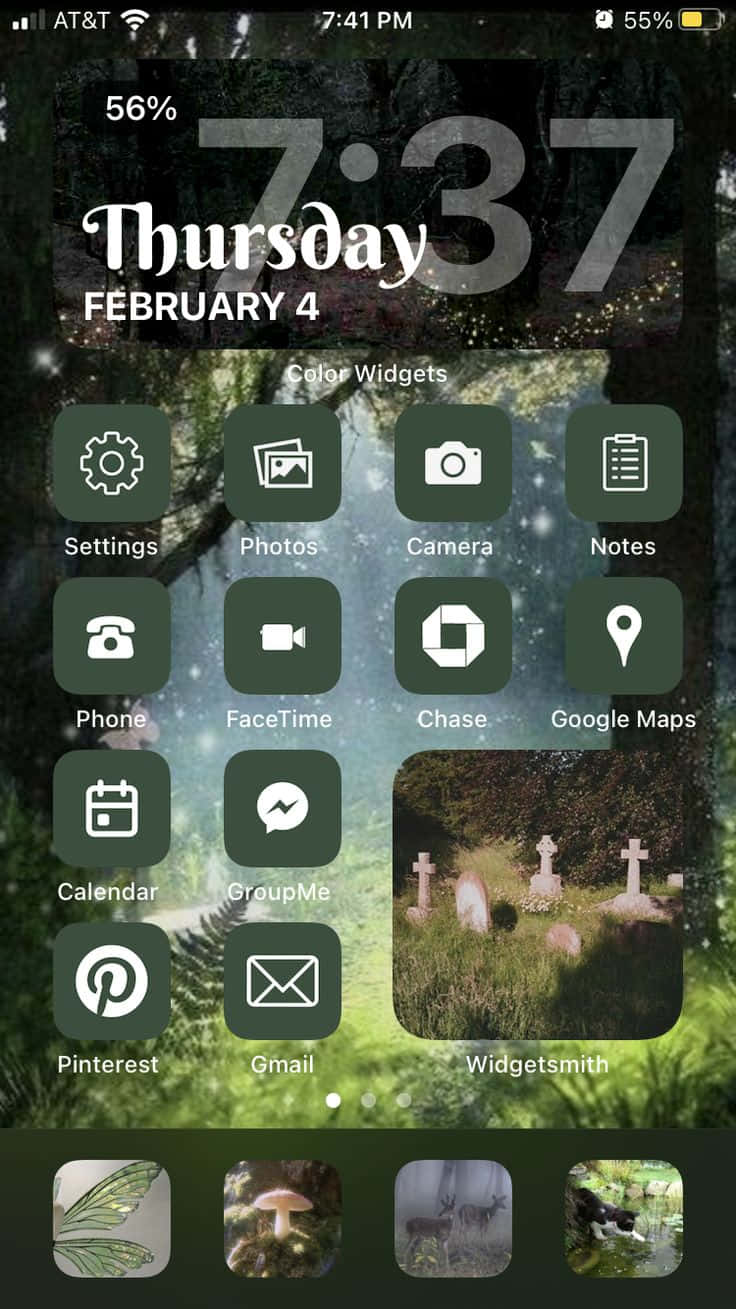 iPhone 美學 桌布 壁紙 — 手機主螢幕，帶有黑暗森林桌布，顯示在暮色天空下發光的燈光和墓碑。