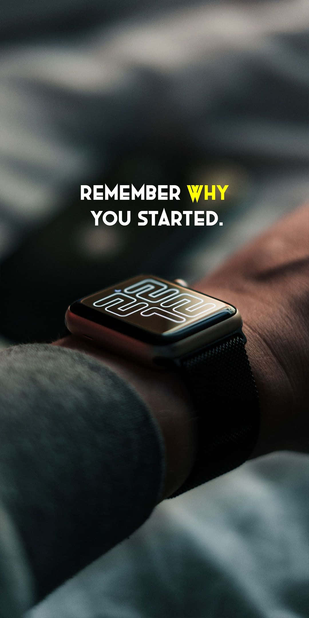 桌布 壁紙 — 手腕上智慧手錶的特寫，疊加了勵志文字「remember why you started」。