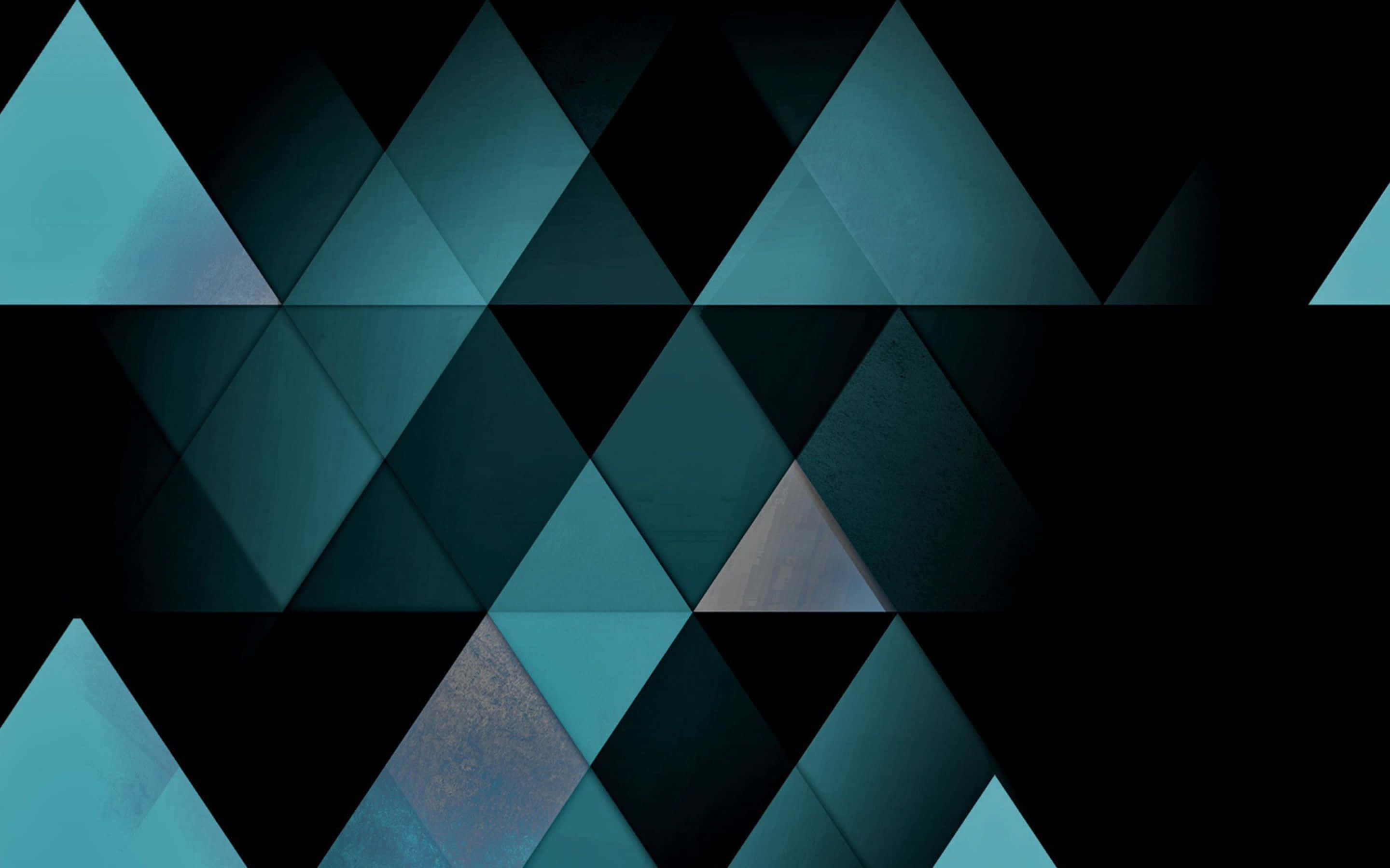 Geometric Desktop 桌布 壁紙 — 抽象幾何圖案壁紙，以青綠色和黑色三角形切面營造現代數位藝術風格。