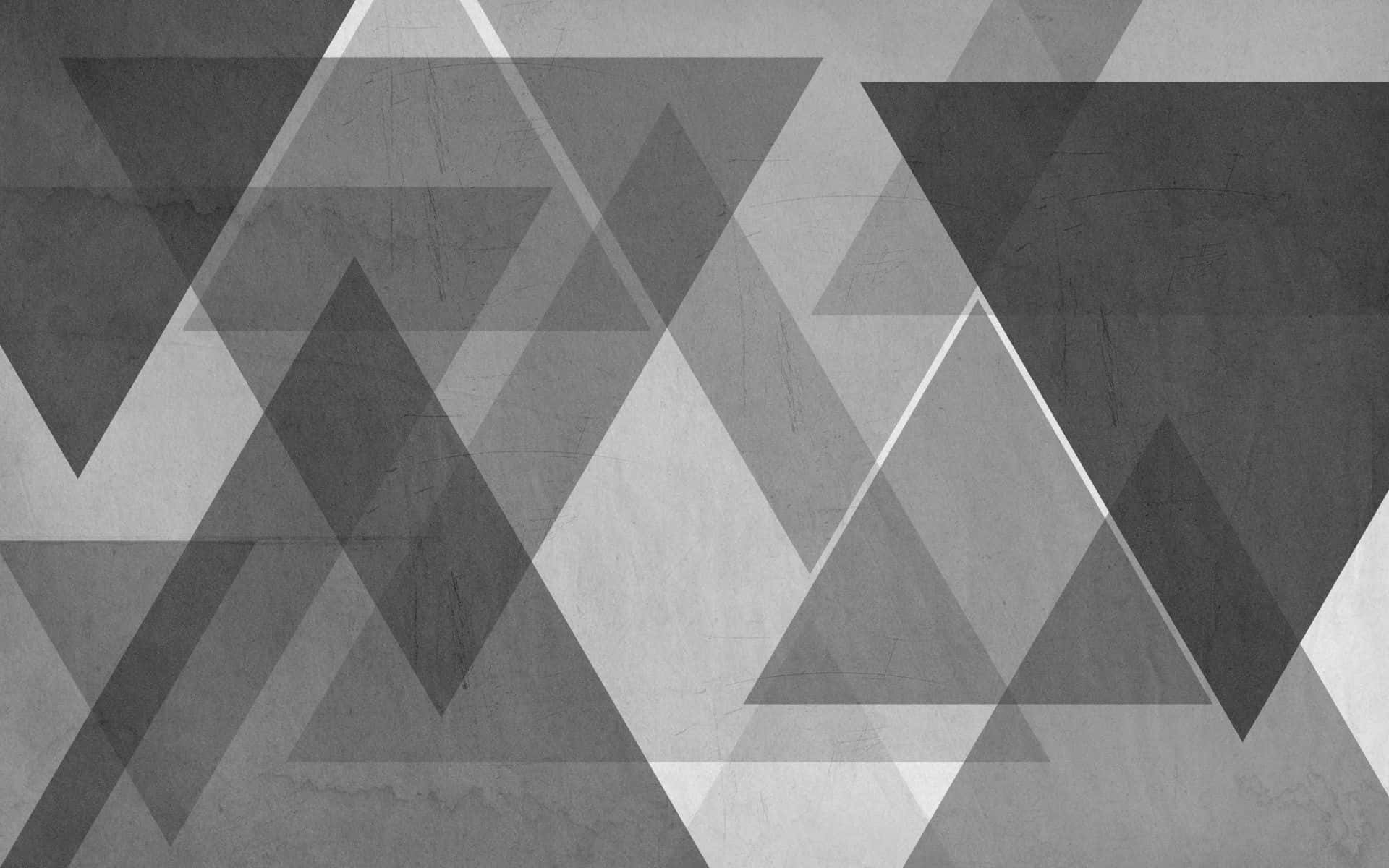 triangle 桌布 壁紙 — 抽象幾何壁紙，在紋理混凝土背景上以灰階色調呈現重疊三角形。