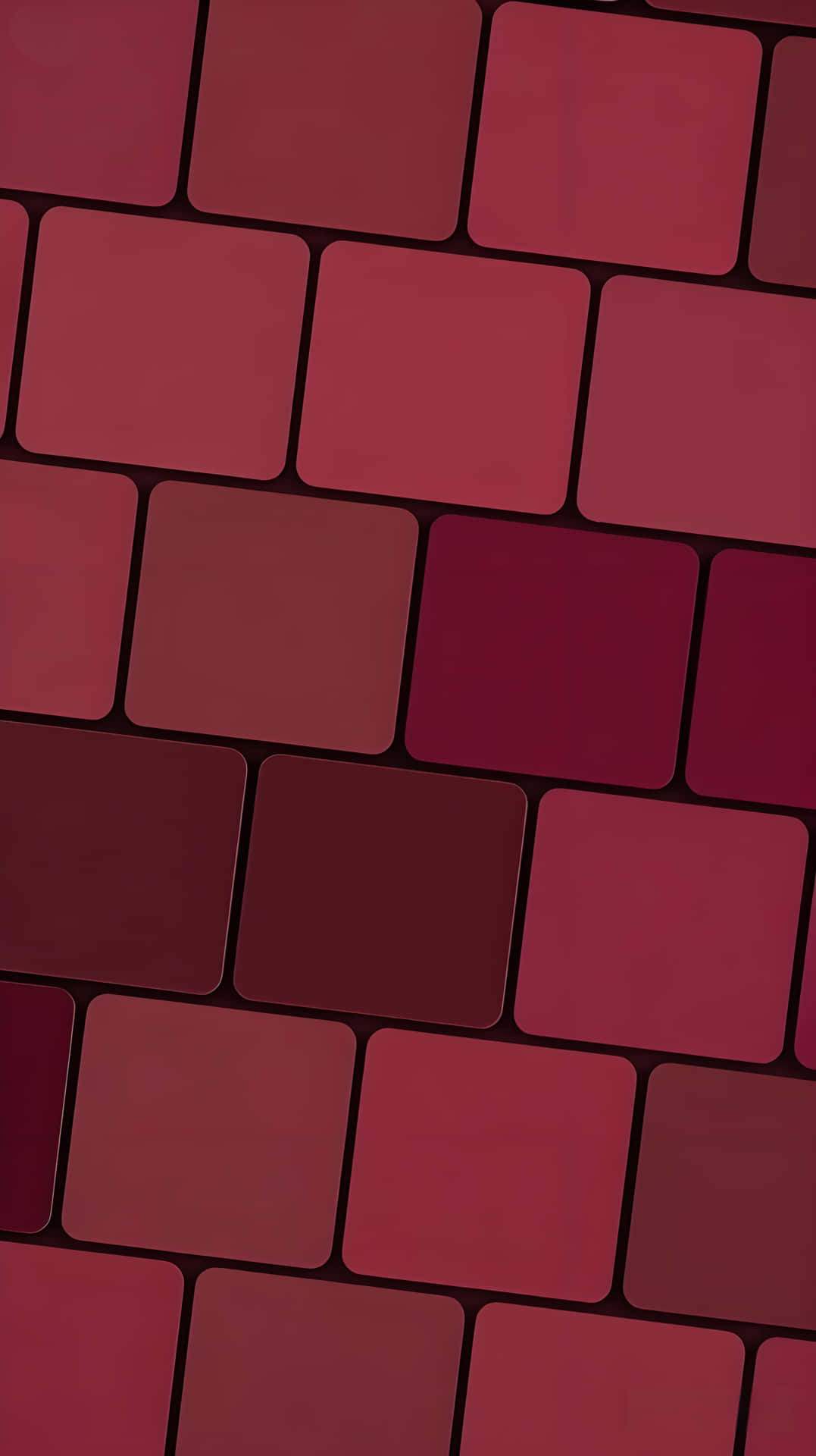 Burgundy Brick Pattern Minimalist Wallpaper 壁紙 — 抽象桌布，由不同深淺紅色的圓角正方形以交錯網格圖案排列而成。