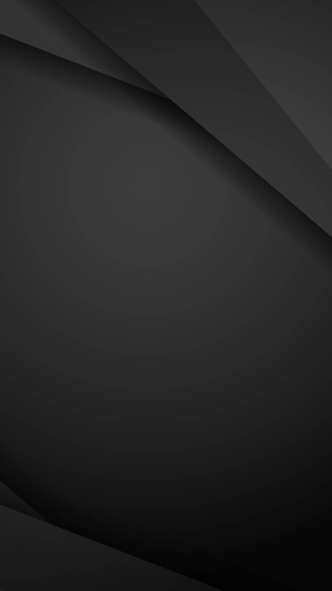 Black Android 桌布 壁紙 — 抽象深灰色幾何圖案壁紙，帶有柔和漸變和棱角摺疊，營造出極簡現代美學。