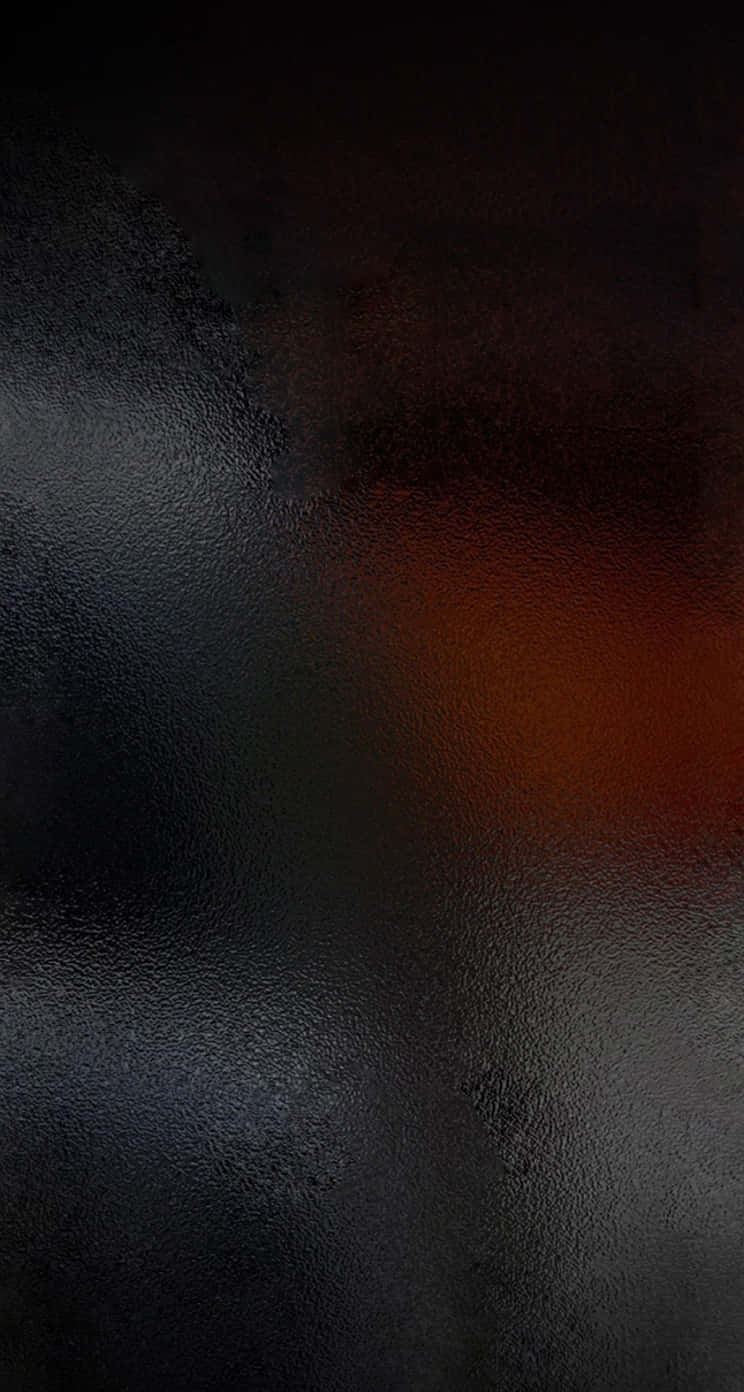 Black Blur 桌布 壁紙 — 抽象深色紋理表面，帶有微妙的橙色光芒和柔和漸變照明。