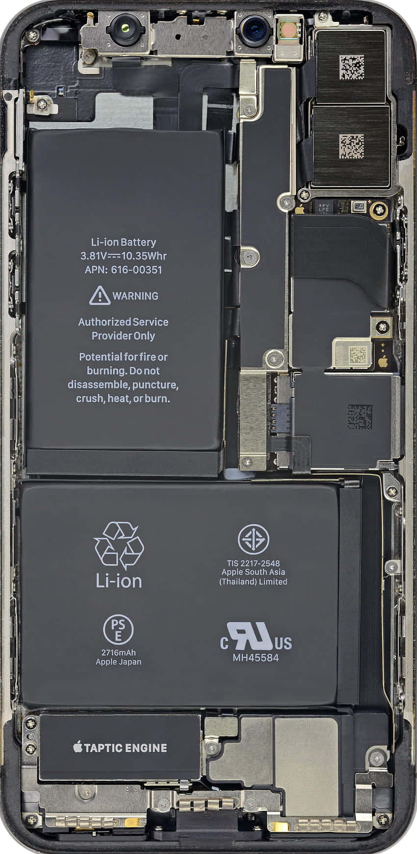 手機 桌布 壁紙 — 拆解智慧型手機的內部組件暴露，顯示電池、觸覺引擎和電路。
