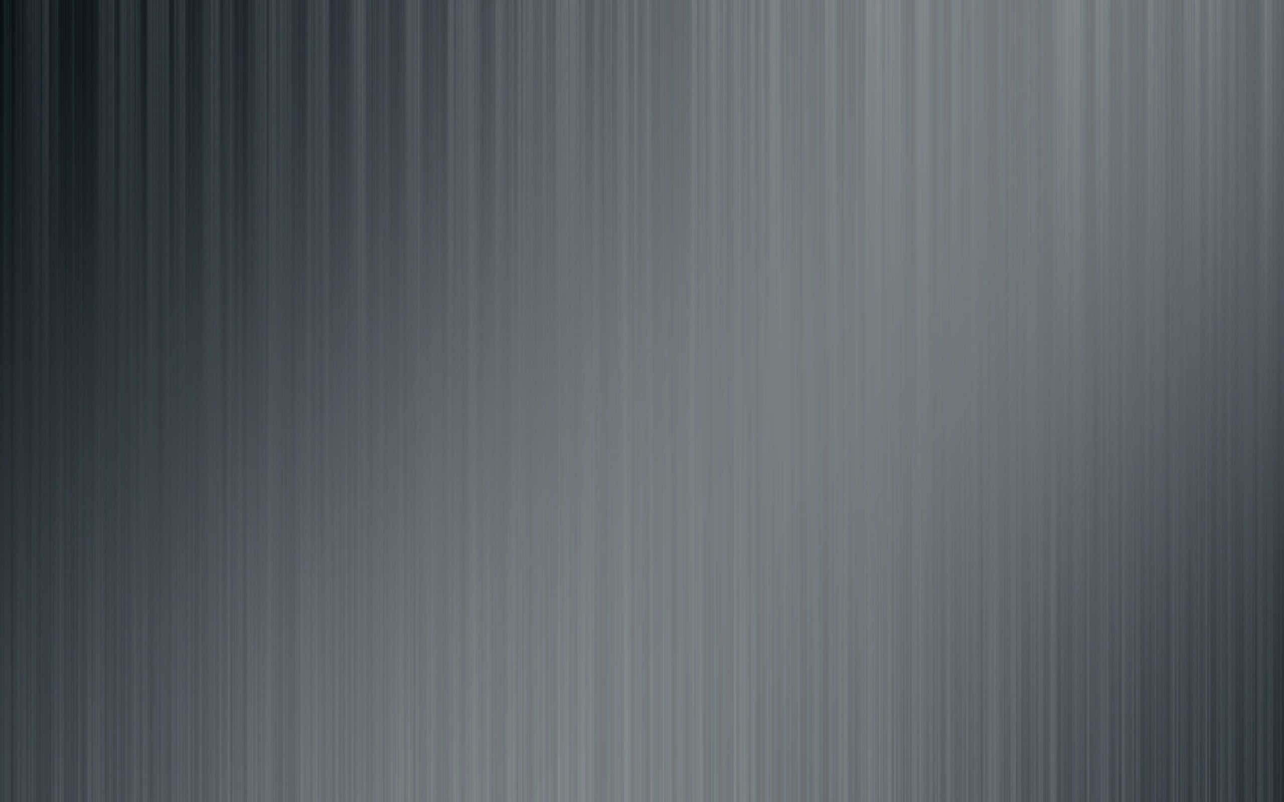 Grey Desktop 桌布 壁紙 — 拉絲金屬表面，帶有垂直線條和從深灰到淺灰的漸變。