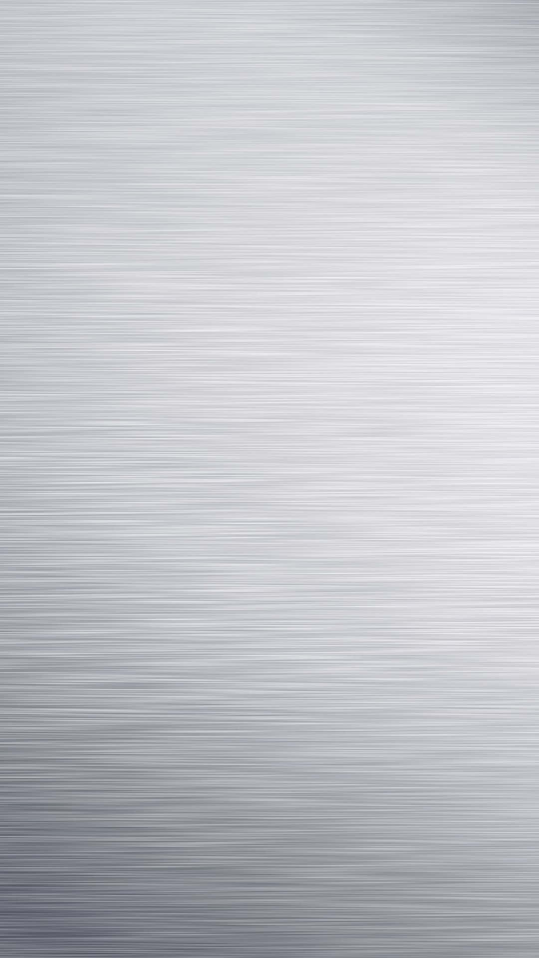 Silver Aesthetic iPhone 桌布 壁紙 — 拉絲金屬表面的特寫，帶有水平線條和從淺灰色到深灰色的柔和漸變。