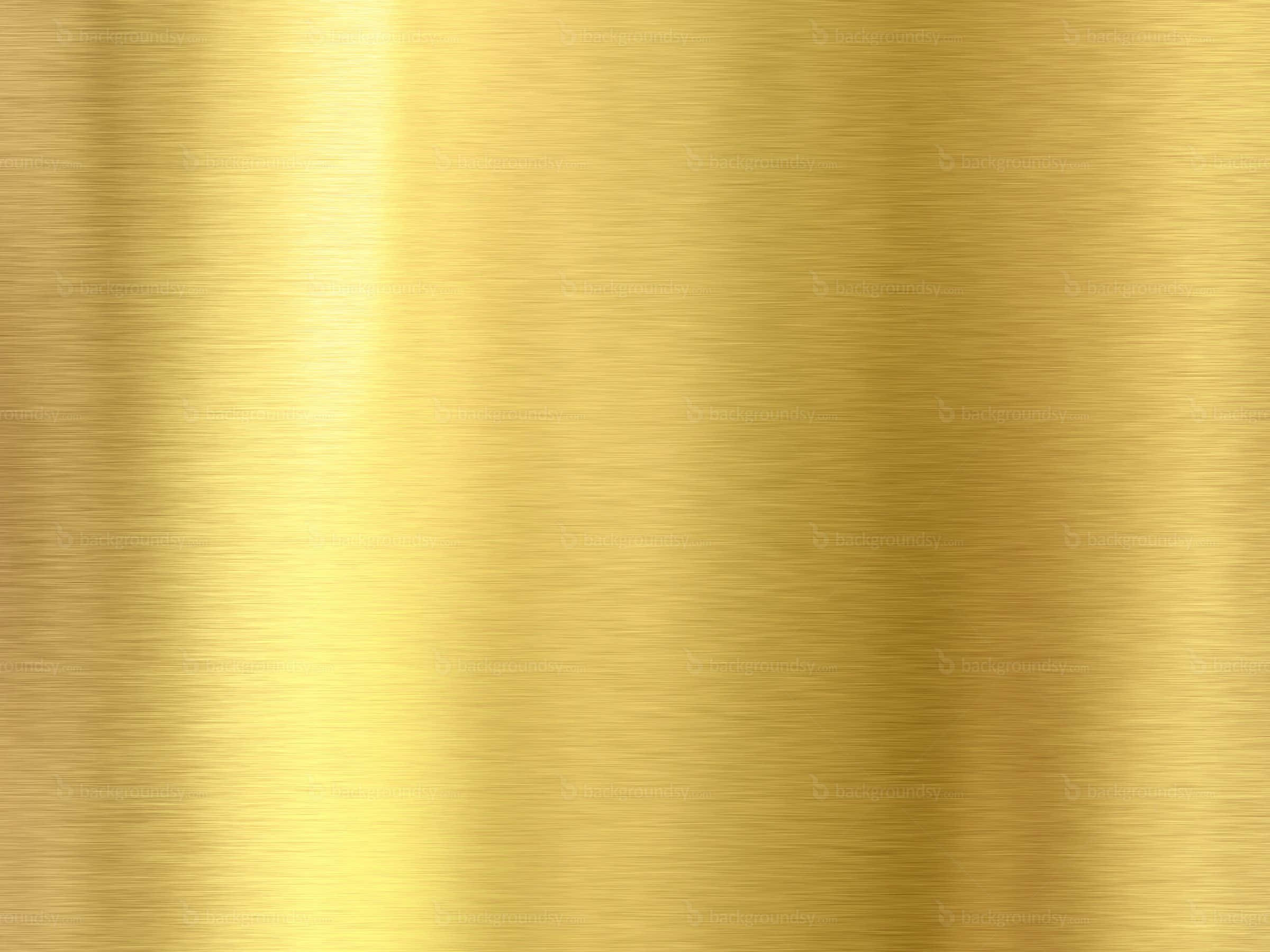 High Resolution Gold 桌布 壁紙 — 拉絲金色金屬表面，帶有柔和的光線漸變和水平紋理圖案。