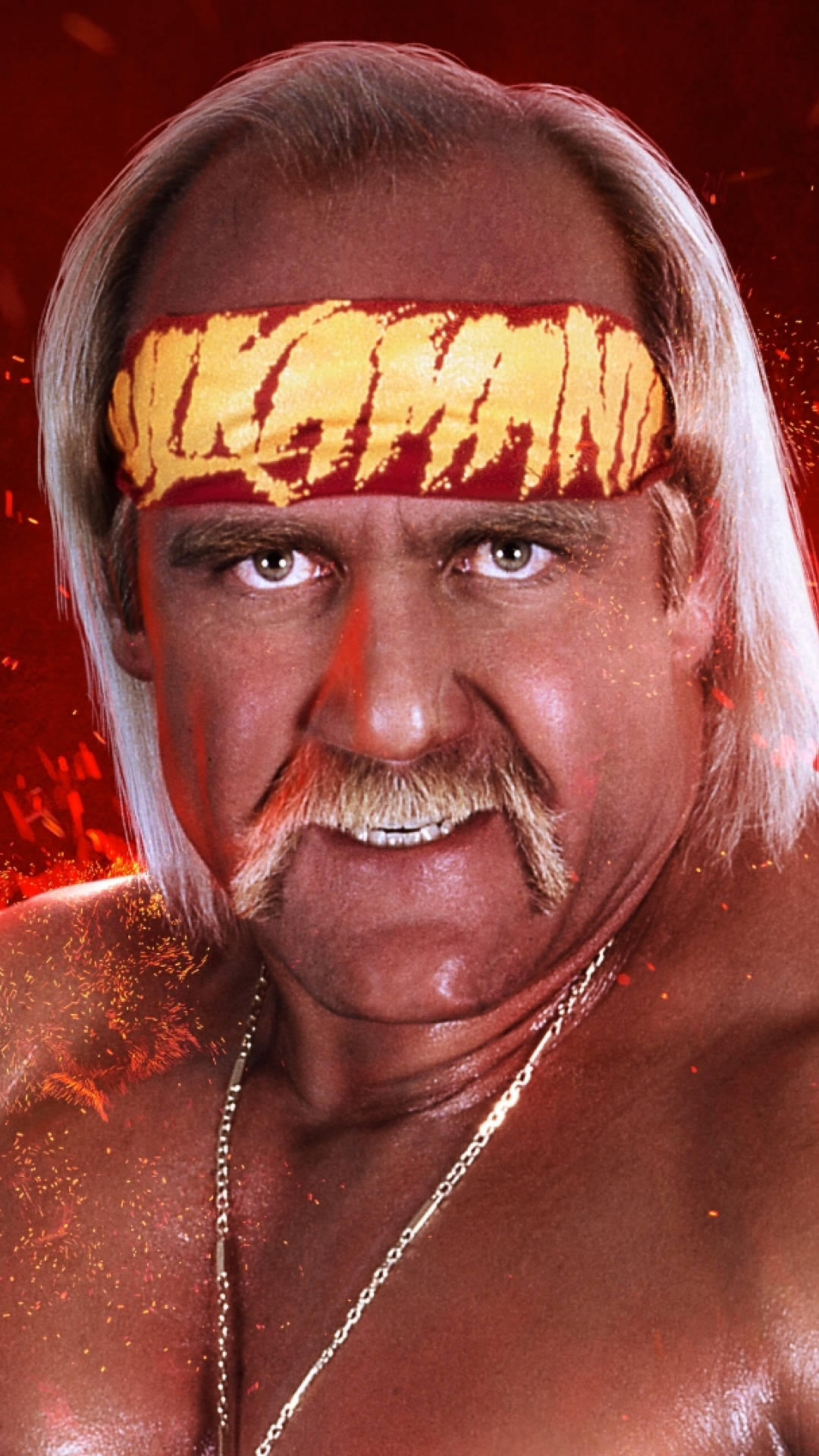 Hulk Hogan 桌布 壁紙 — 摔角手 Hulk Hogan 在火紅背景前，戴著標誌性的黃紅頭帶，凝視著鏡頭。
