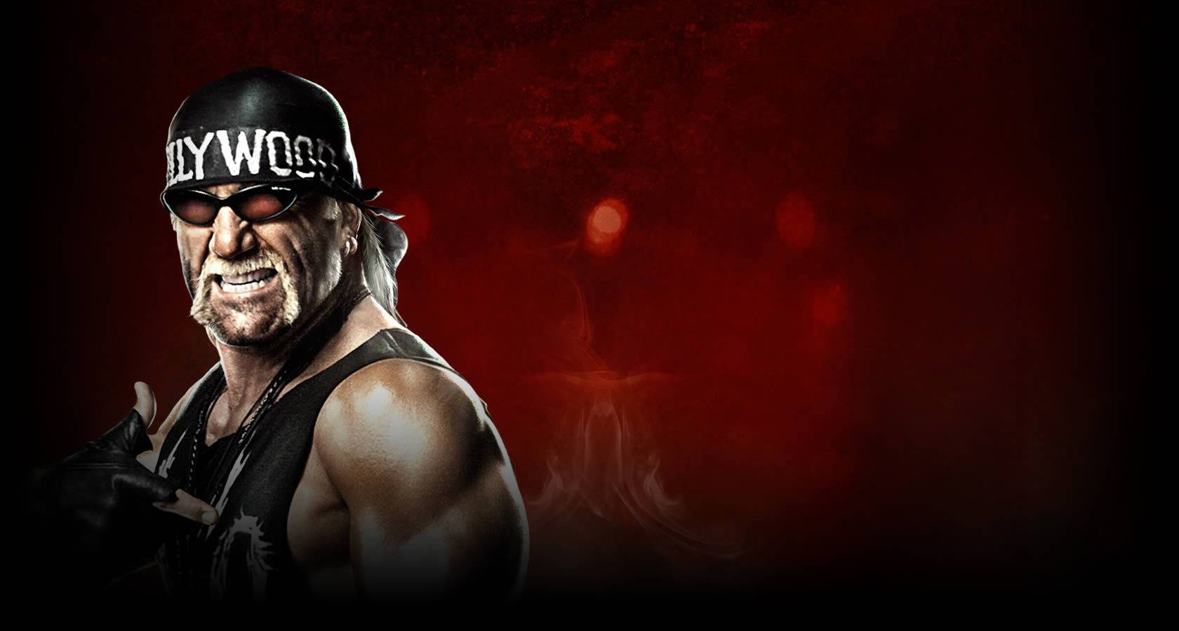 Hulk Hogan 桌布 壁紙 — 摔角手 Hulk Hogan 戴黑色帽子和太陽眼鏡，在煙霧瀰漫的紅色背景前擺姿勢，燈光效果戲劇化。