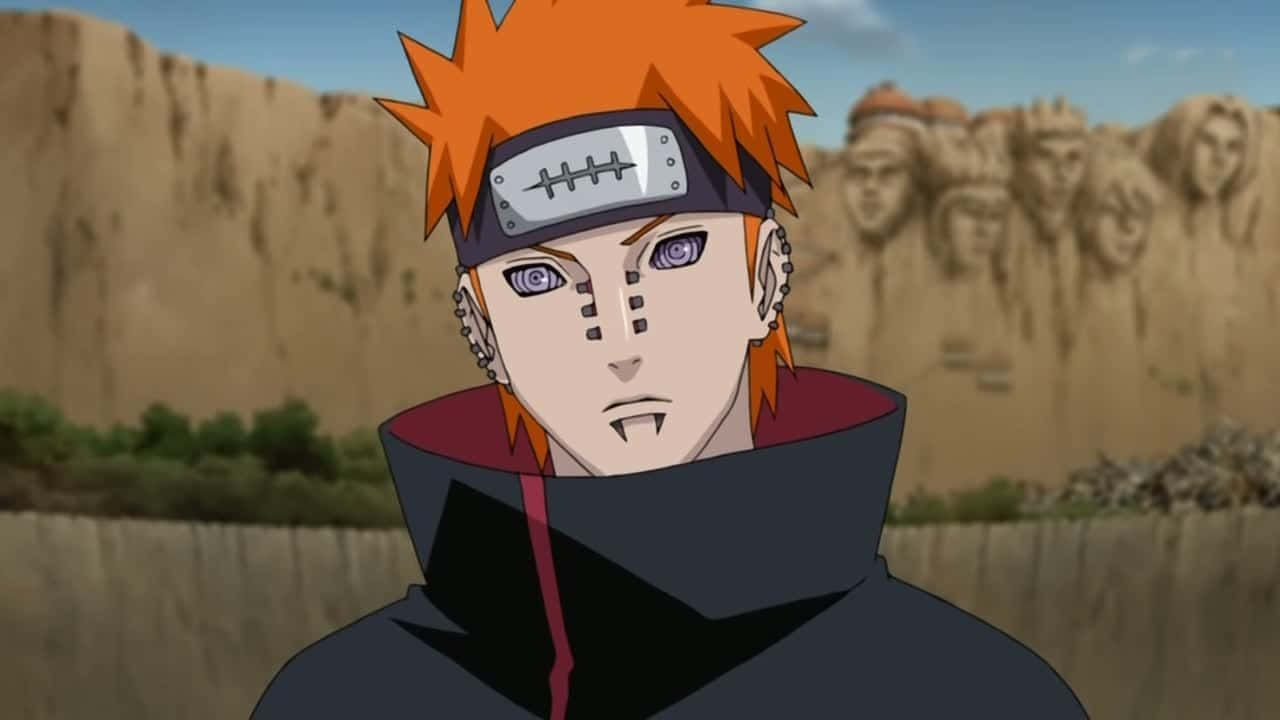 Nagato 桌布 壁紙 — 擁有尖刺橙色頭髮和紫色眼睛的動漫角色站在雕刻著面孔的懸崖前。