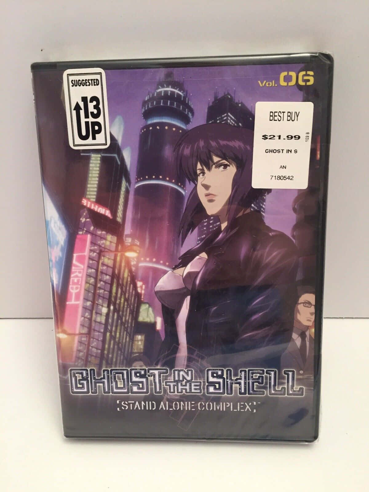 攻殼機動隊 桌布 壁紙 — 《攻殼機動隊 STAND ALONE COMPLEX》動畫DVD封面，以霓虹燈照亮的城市景觀為背景，展示一位賽博龐克女性主角。