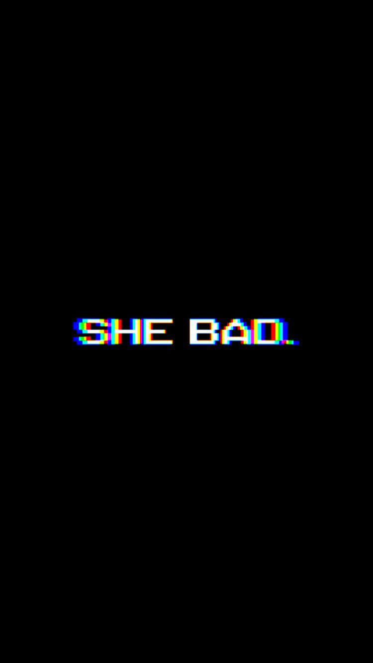 glitch art 桌布 壁紙 — 故障像素文字在純黑色背景上顯示「SHE BAD」，帶有彩虹色差效果。