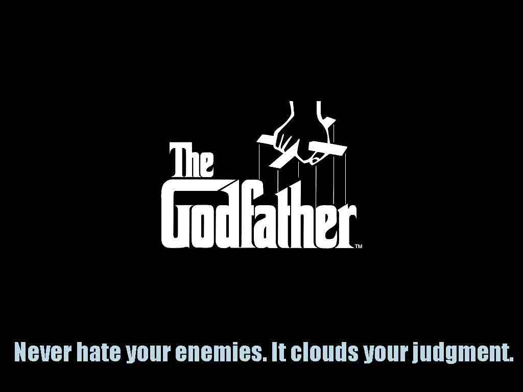 Godfather 桌布 壁紙 — 《教父》標誌以白色文字顯示在黑色背景上，上方有木偶手，下方有引文。