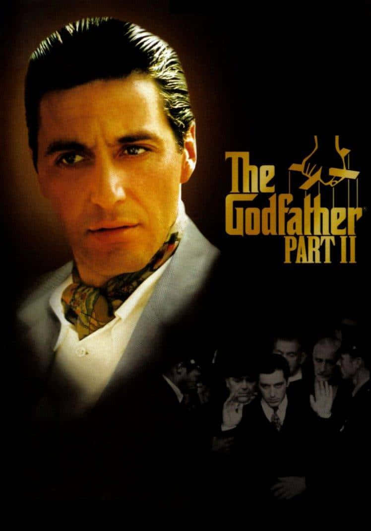 The Godfather 桌布 壁紙 — 《教父2》的戲劇性電影海報，以深色背景為襯托，展示一位身穿西裝、繫著圖案領帶的嚴肅男子。