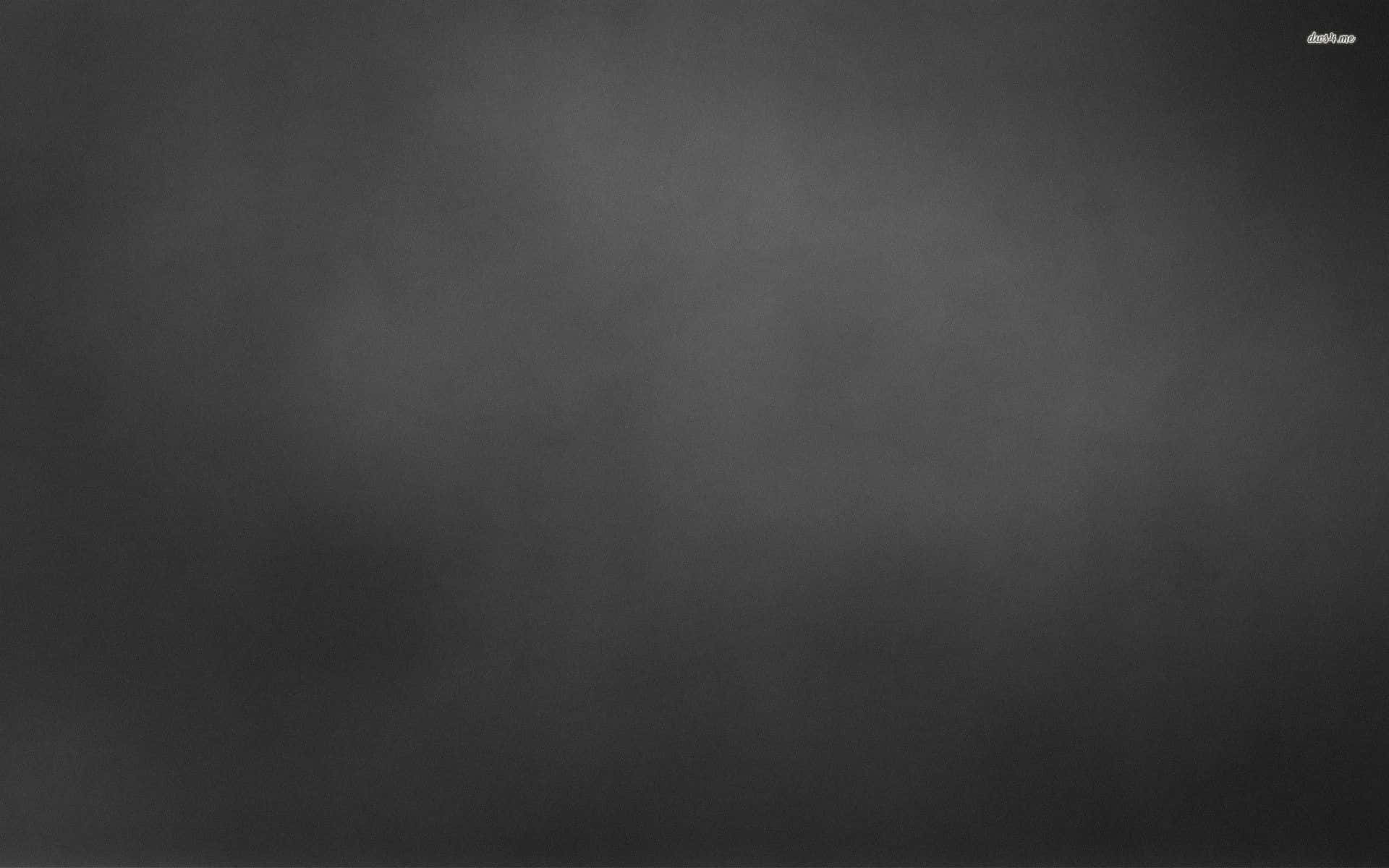 Black And Grey 桌布 壁紙 — 整個畫面呈現深灰色調的平滑漸變，帶有細微的紋理變化。