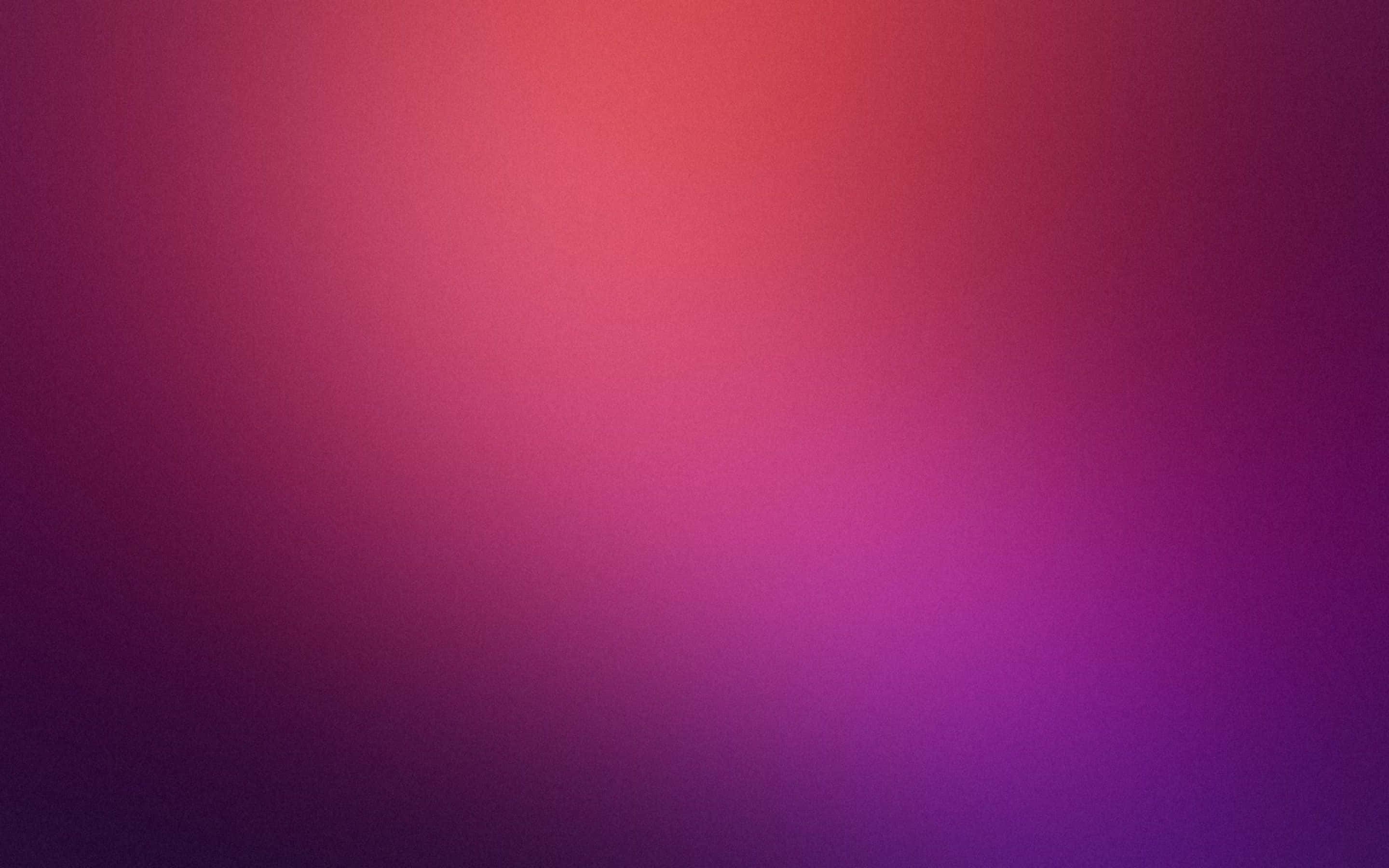 Purple Desktop 桌布 壁紙 — 整個畫面從溫暖的珊瑚粉過渡到深紫羅蘭色的平滑漸變。