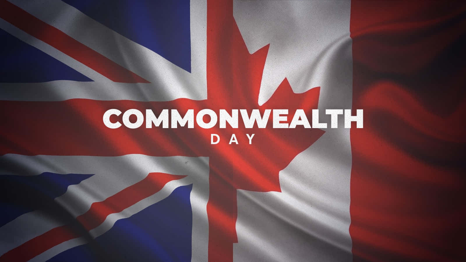 Commonwealth Day 桌布 壁紙 — 數位渲染的旗幟，融合英國國旗和加拿大楓葉，並以粗體白色文字寫著 Commonwealth Day。