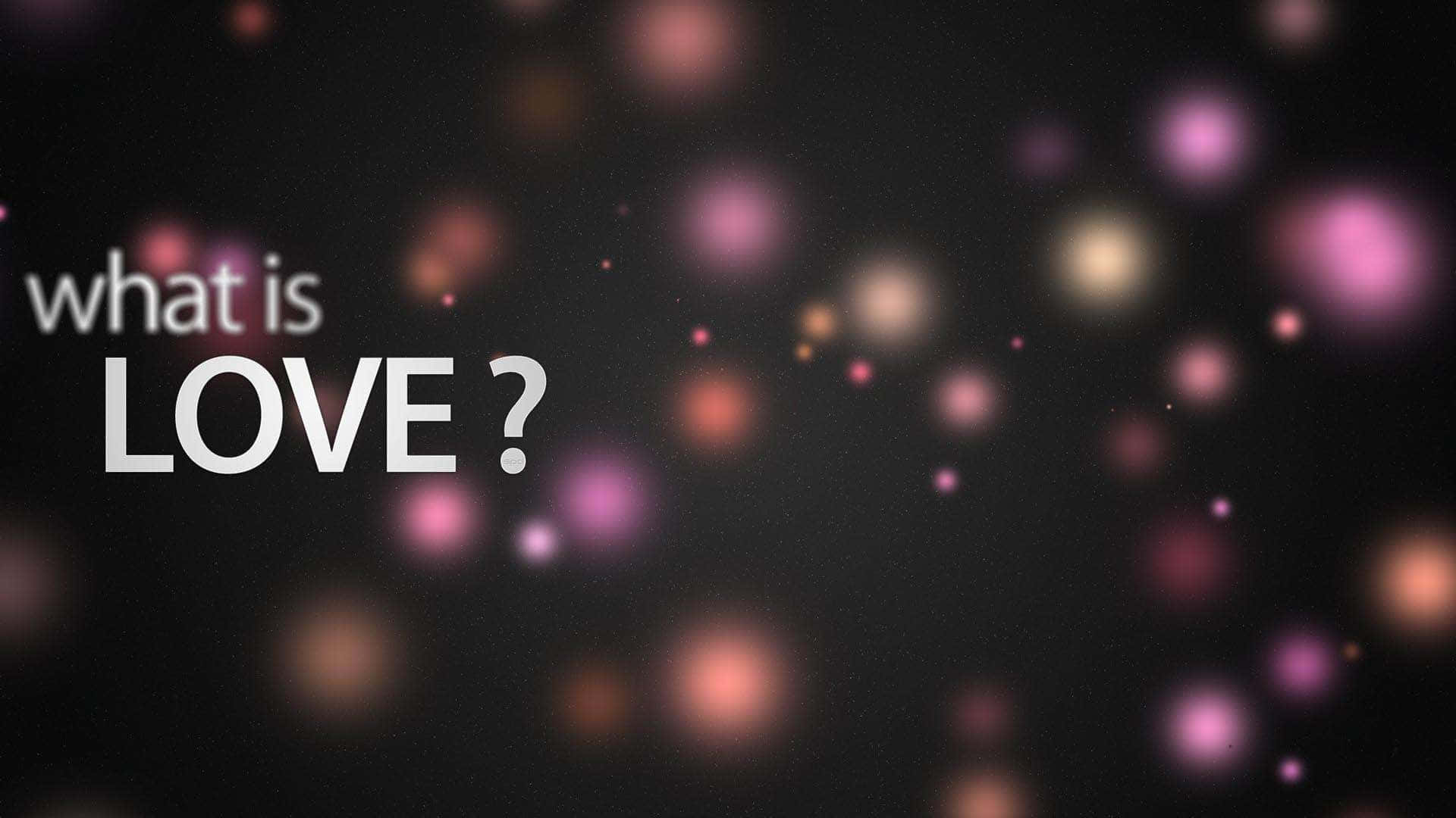 愛心 桌布 壁紙 — 文字問「愛是什麼？」漂浮在柔和發光的粉紅色和橙色散景燈光的黑暗背景下。
