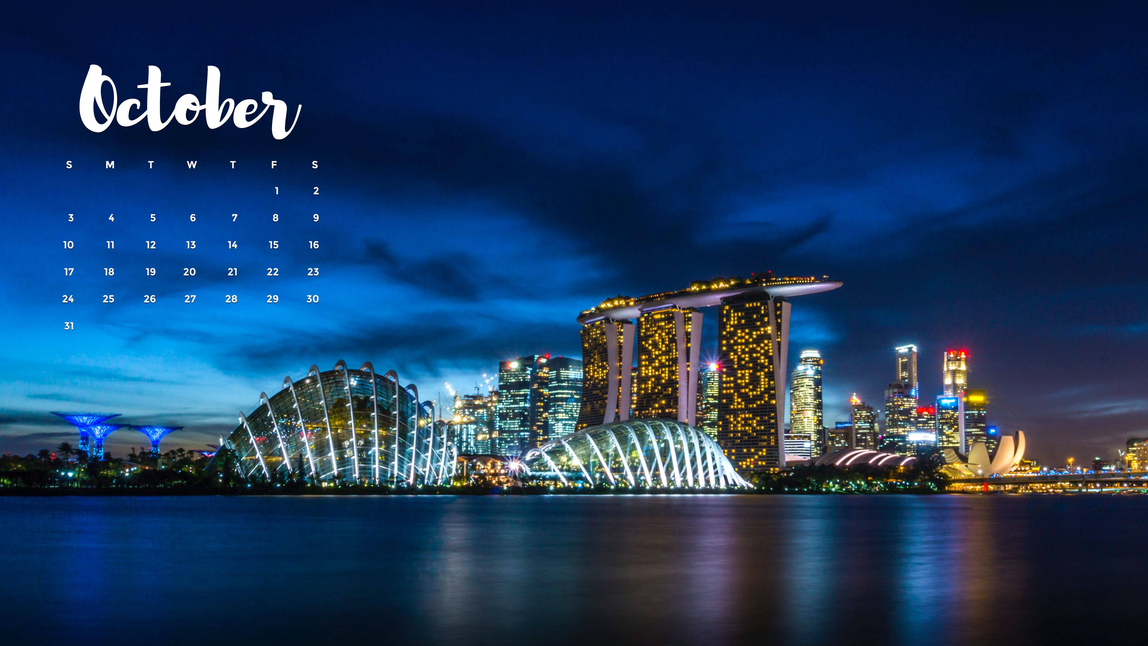 October 桌布 壁紙 — 新加坡天際線的壯麗夜景，濱海灣金沙和濱海灣花園在深藍色的暮色天空下閃耀。