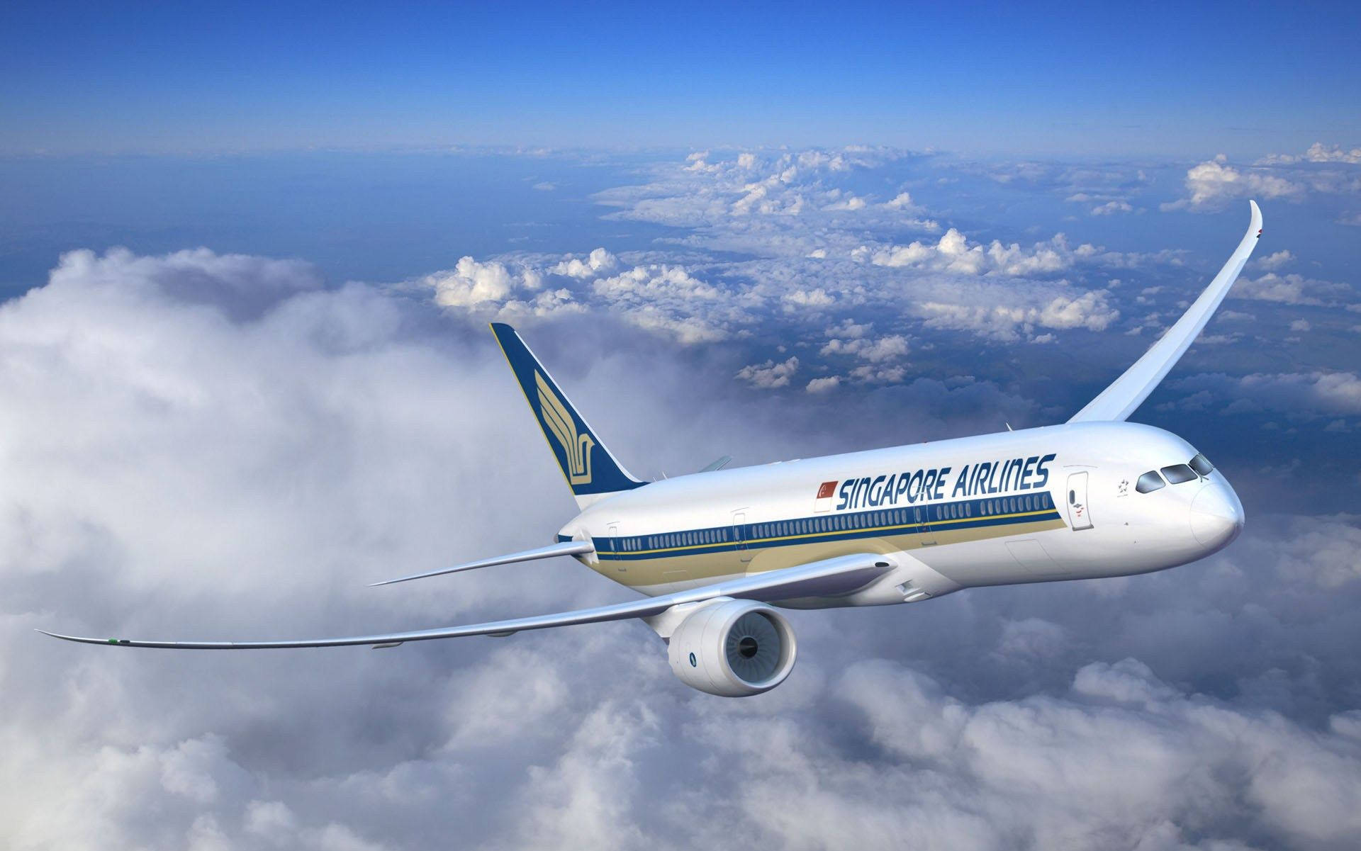 飛機 桌布 壁紙 — 新加坡航空的波音787在晴朗藍天下優雅地翱翔於蓬鬆白雲之上。