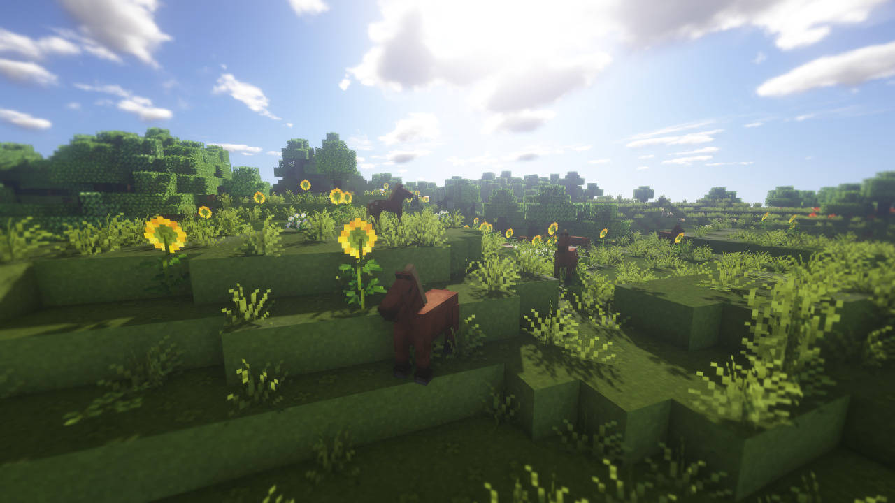 電玩遊戲 桌布 壁紙 — 方塊狀的馬匹在陽光明媚的Minecraft田野中吃草，田野點綴著向日葵和綠色山丘，上方是明亮的藍天。