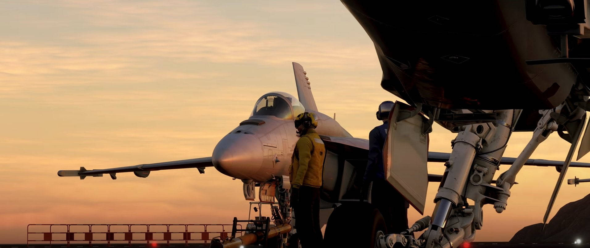日落時分，航空母艦甲板上的戰鬥機及正在工作的機組人員。 — 捍衛戰士：獨行俠 壁紙