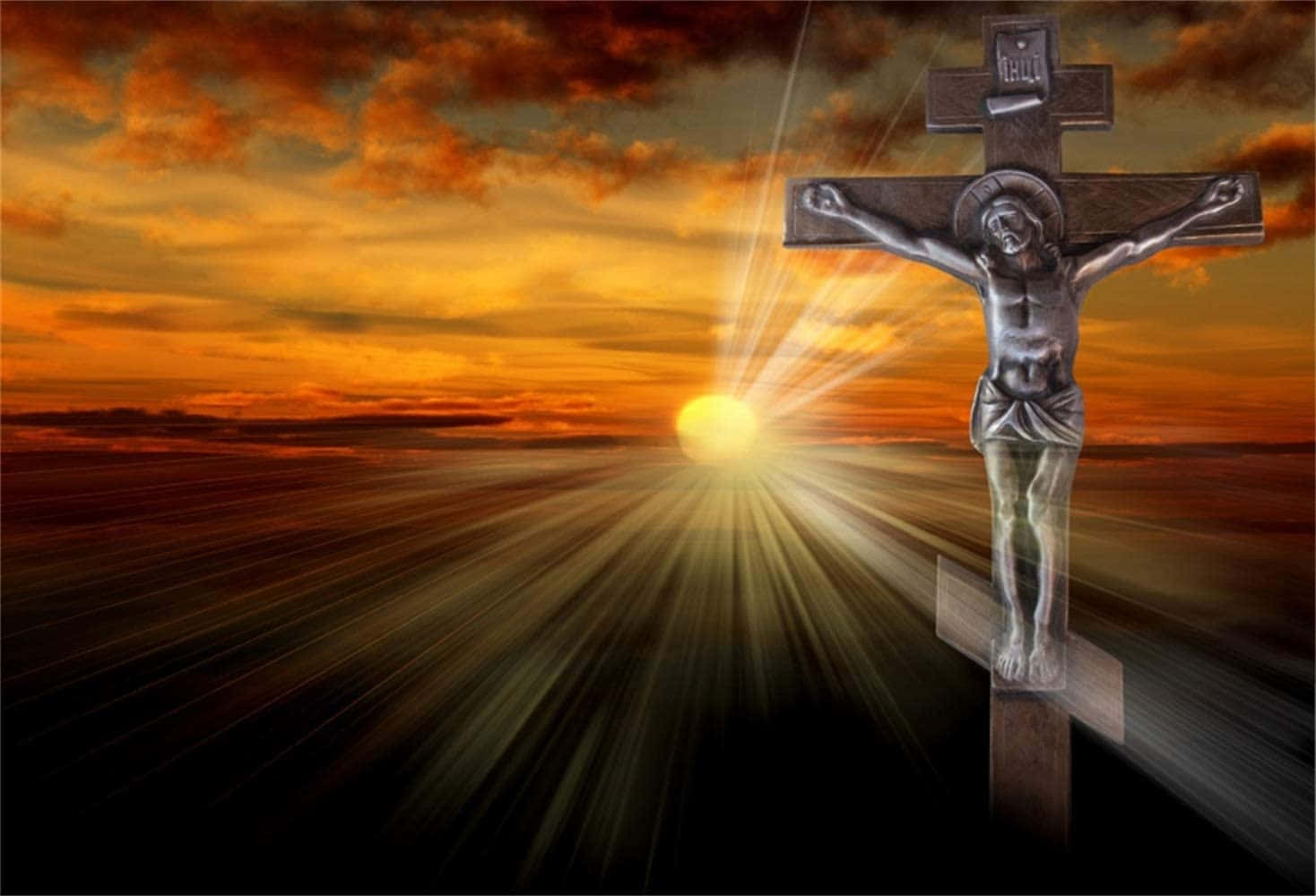 Jesus Crucifixion 桌布 壁紙 — 日落時分光芒四射的 crucifixion 場景，金色光線從黑暗十字架後方的太陽迸發而出。