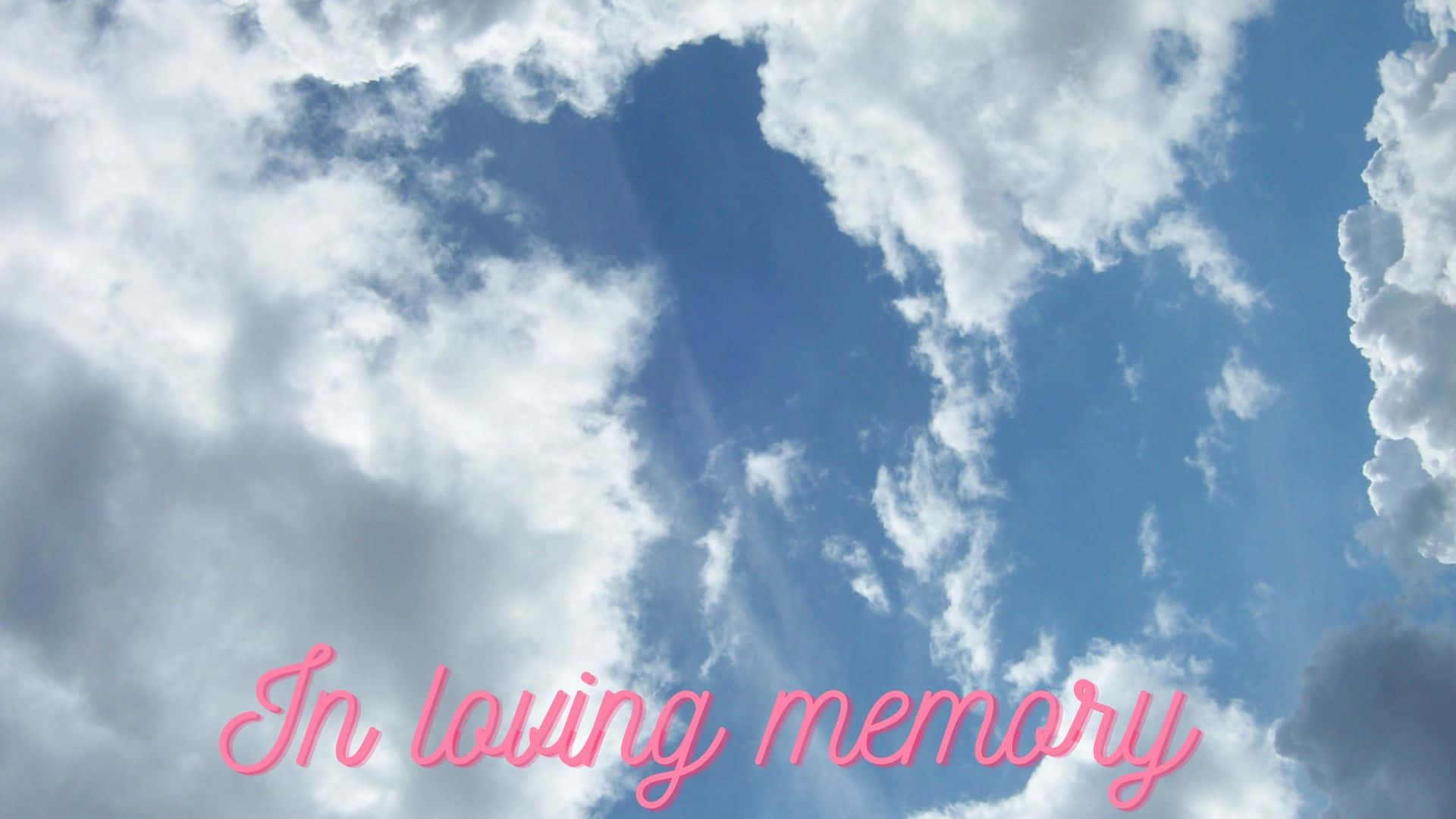 藍天白雲，粉紅色文字寫著「In loving memory」。 — 字型 GIF 壁紙