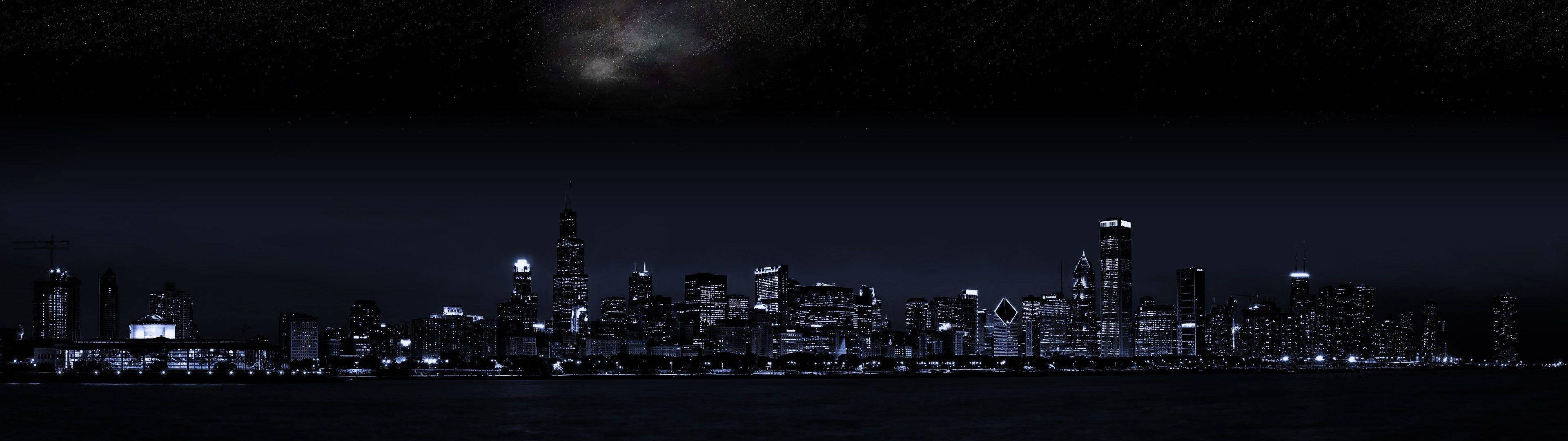 City At Night 桌布 壁紙 — 星空下，暗水中倒映著閃爍摩天大樓的城市天際線全景夜景。