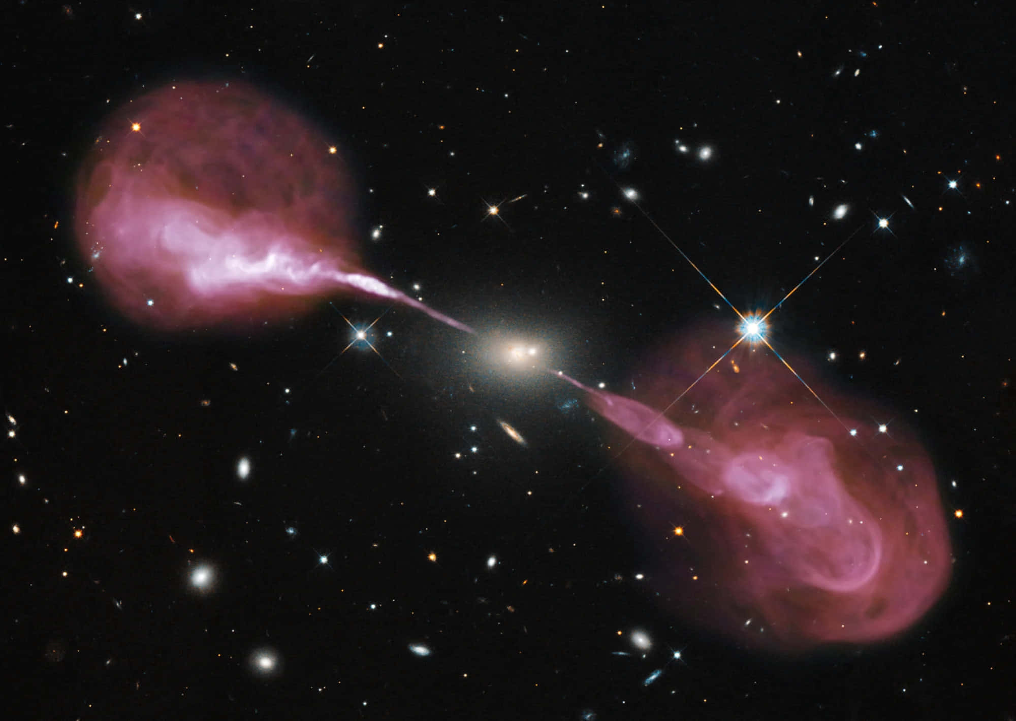 Black Hole Hubble Telescope 桌布 壁紙 — 星系的宇宙碰撞在星空背景下發出充滿活力的粉紅色噴流。