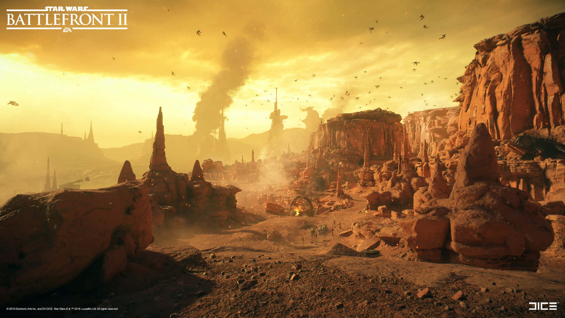 The Battle Of Geonosis 桌布 壁紙 — 《星際大戰：前線II》中，夕陽下的沙漠戰場，高聳的岩石構造、升起的煙霧和飛越頭頂的星際戰機。