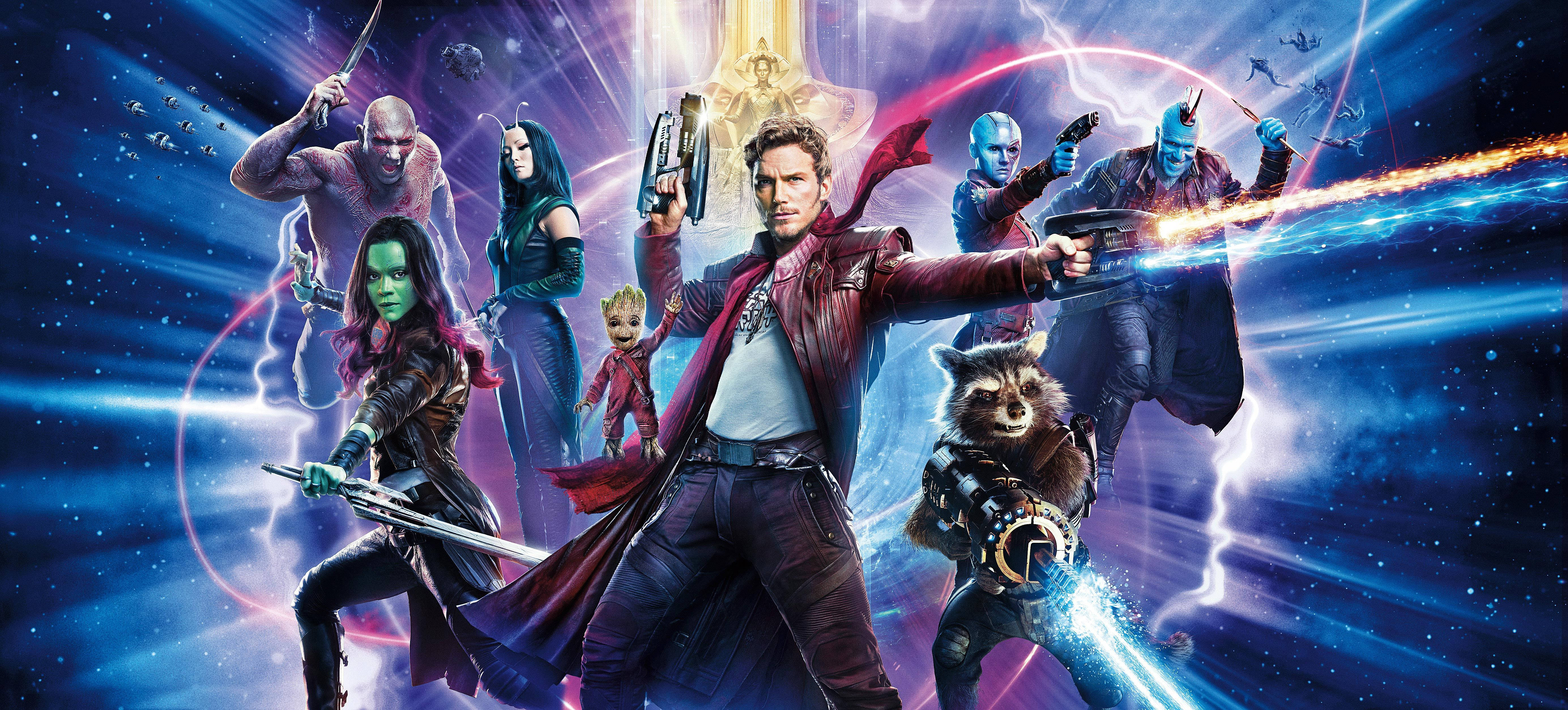 4K Guardians Of The Galaxy 桌布 壁紙 — 星際異攻隊團隊在充滿發光能量光束和星空的宇宙背景下動態擺姿勢。